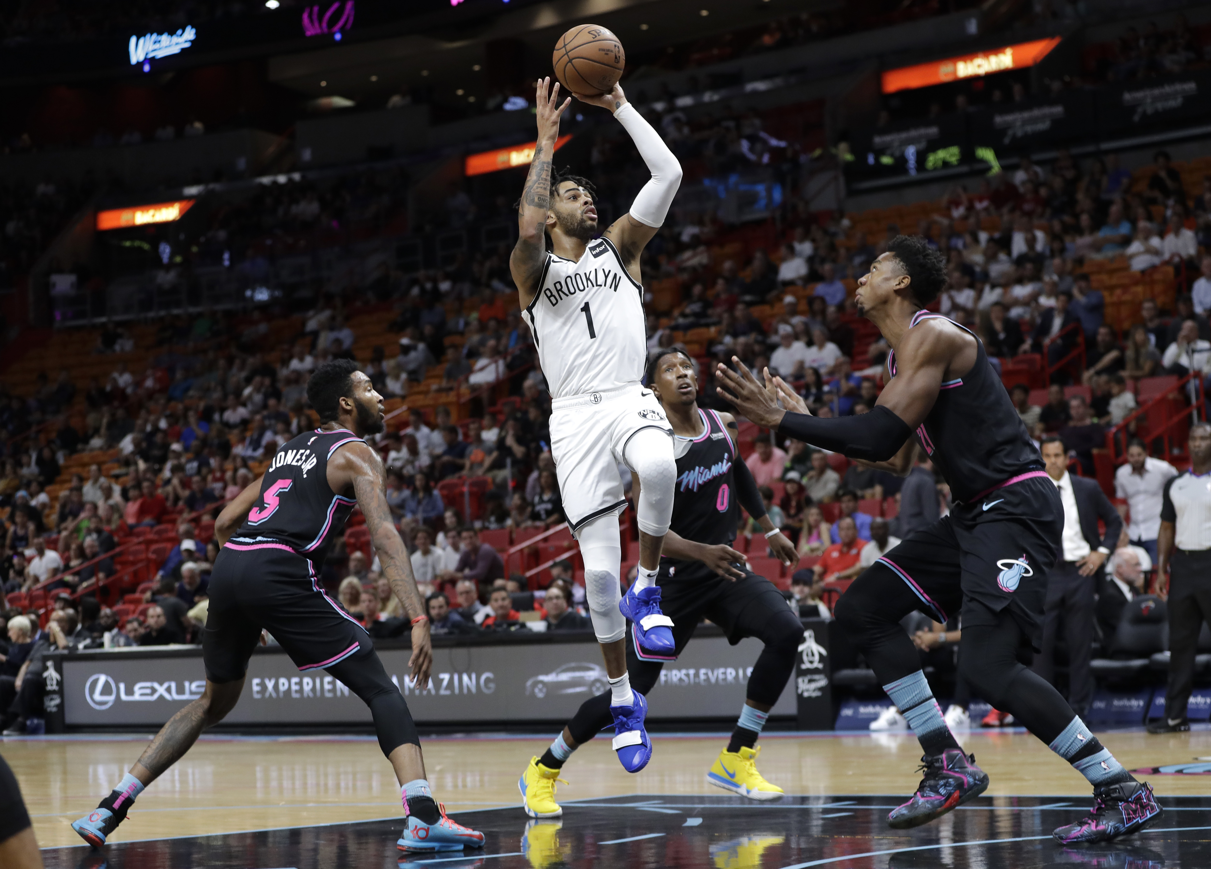 Russell, Nets add to Miami’s home misery, top Heat 104-92