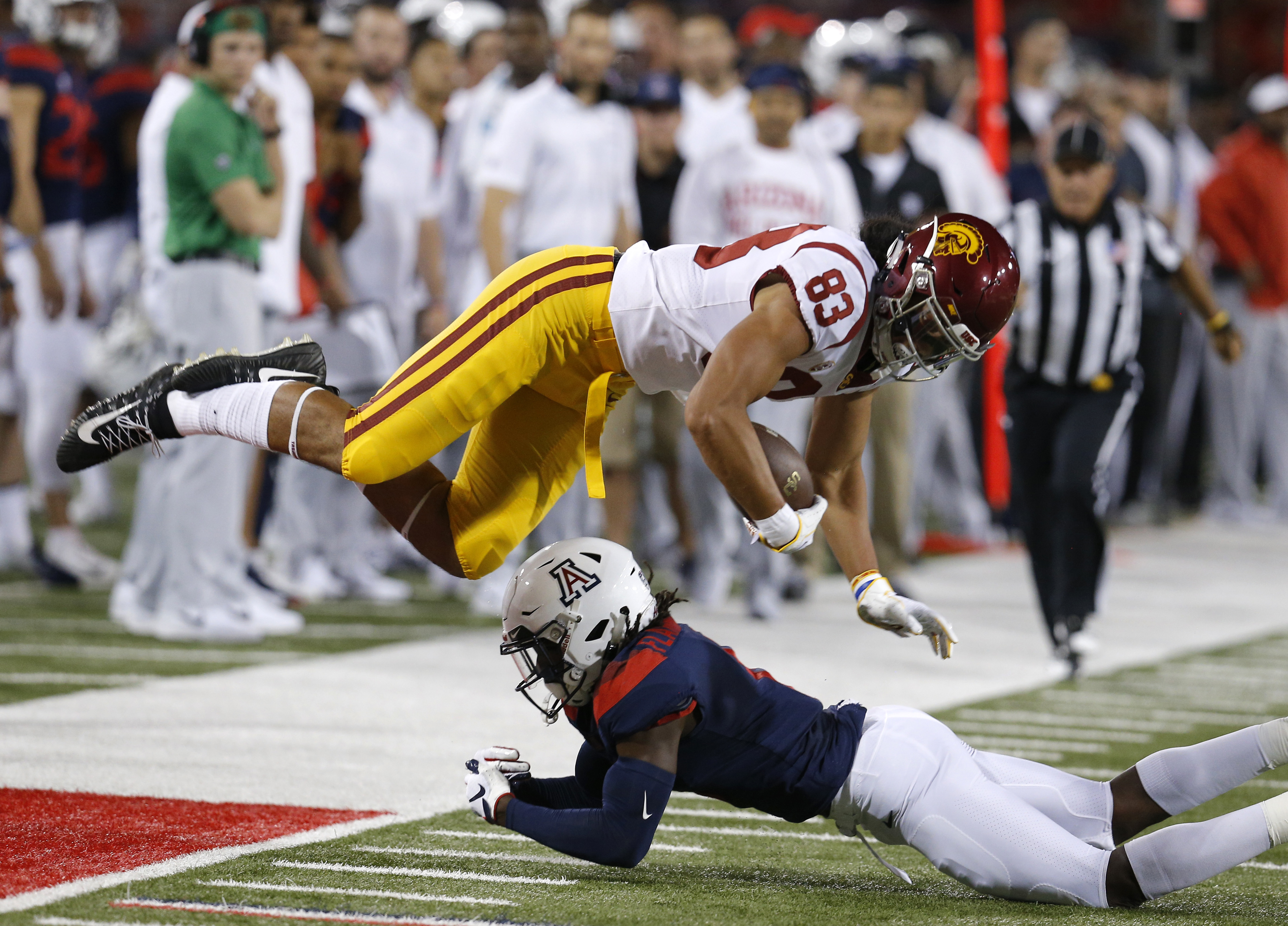 Ware runs for 2 TDs, USC holds off Arizona 24-20