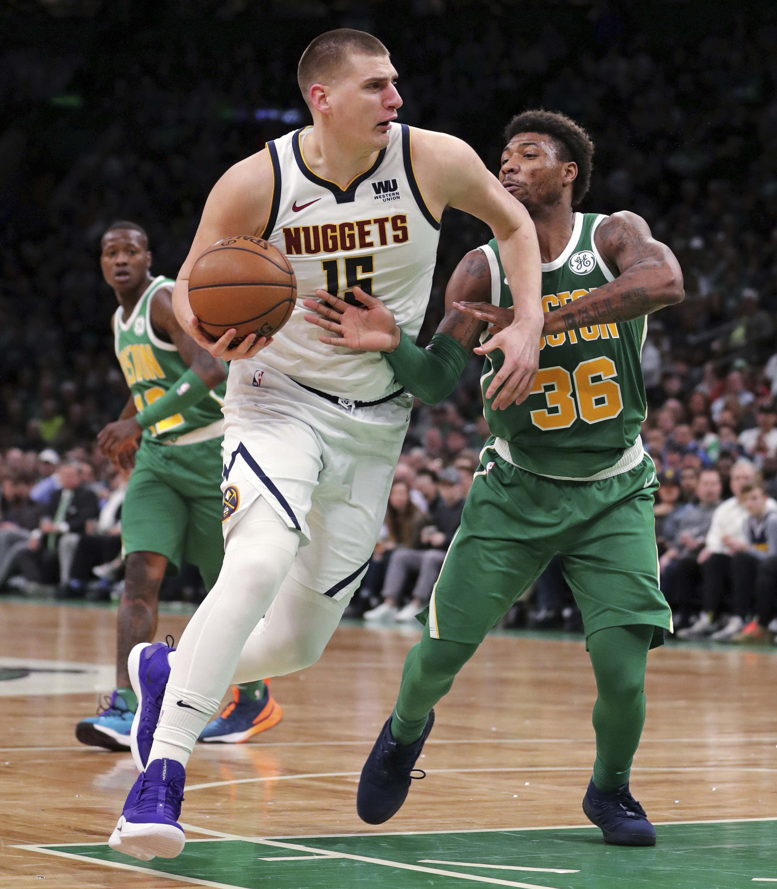 Nuggets clinch playoff spot with win over Celtics