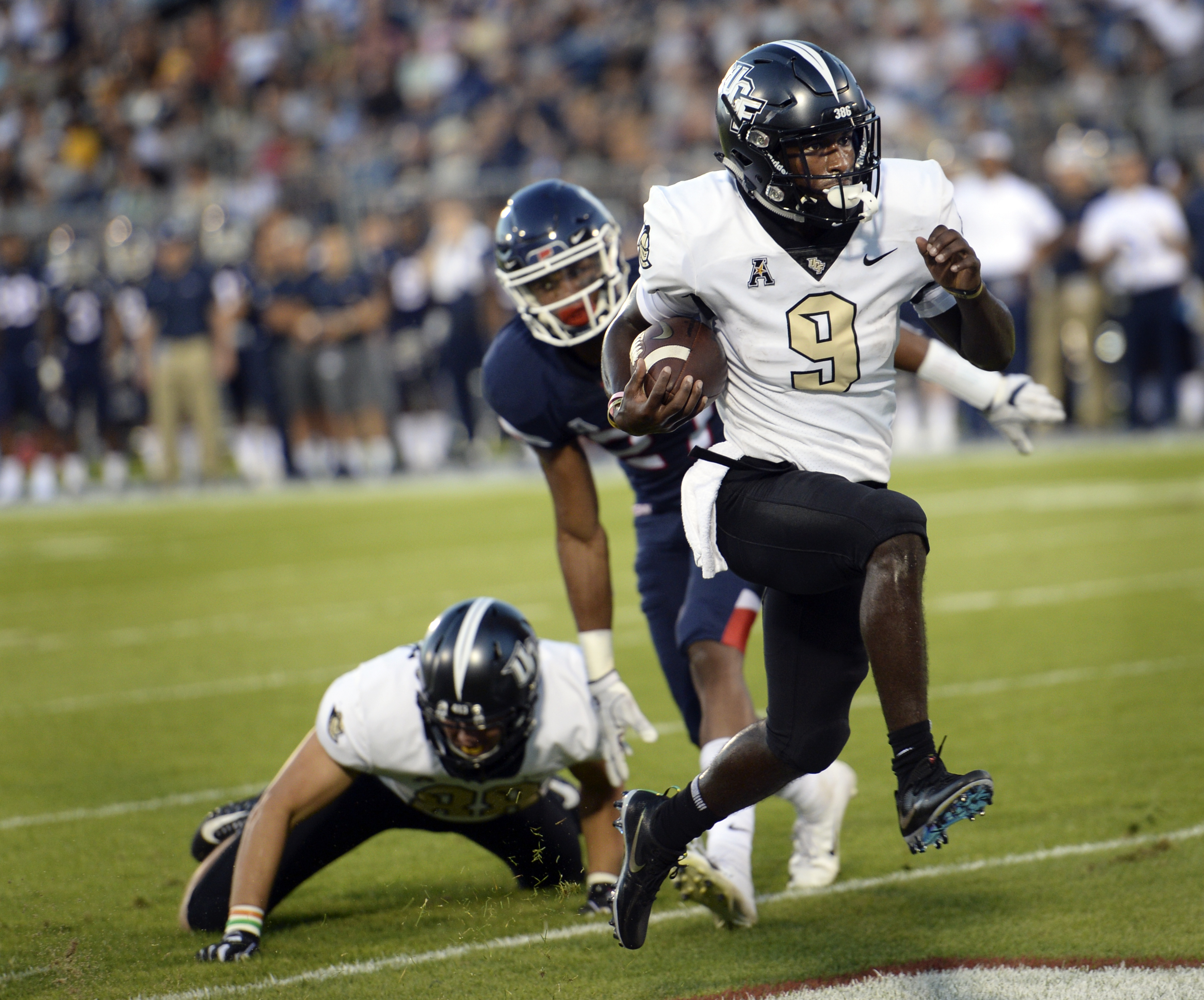 No. 21 UCF extends winning streak to 14 with rout of UConn