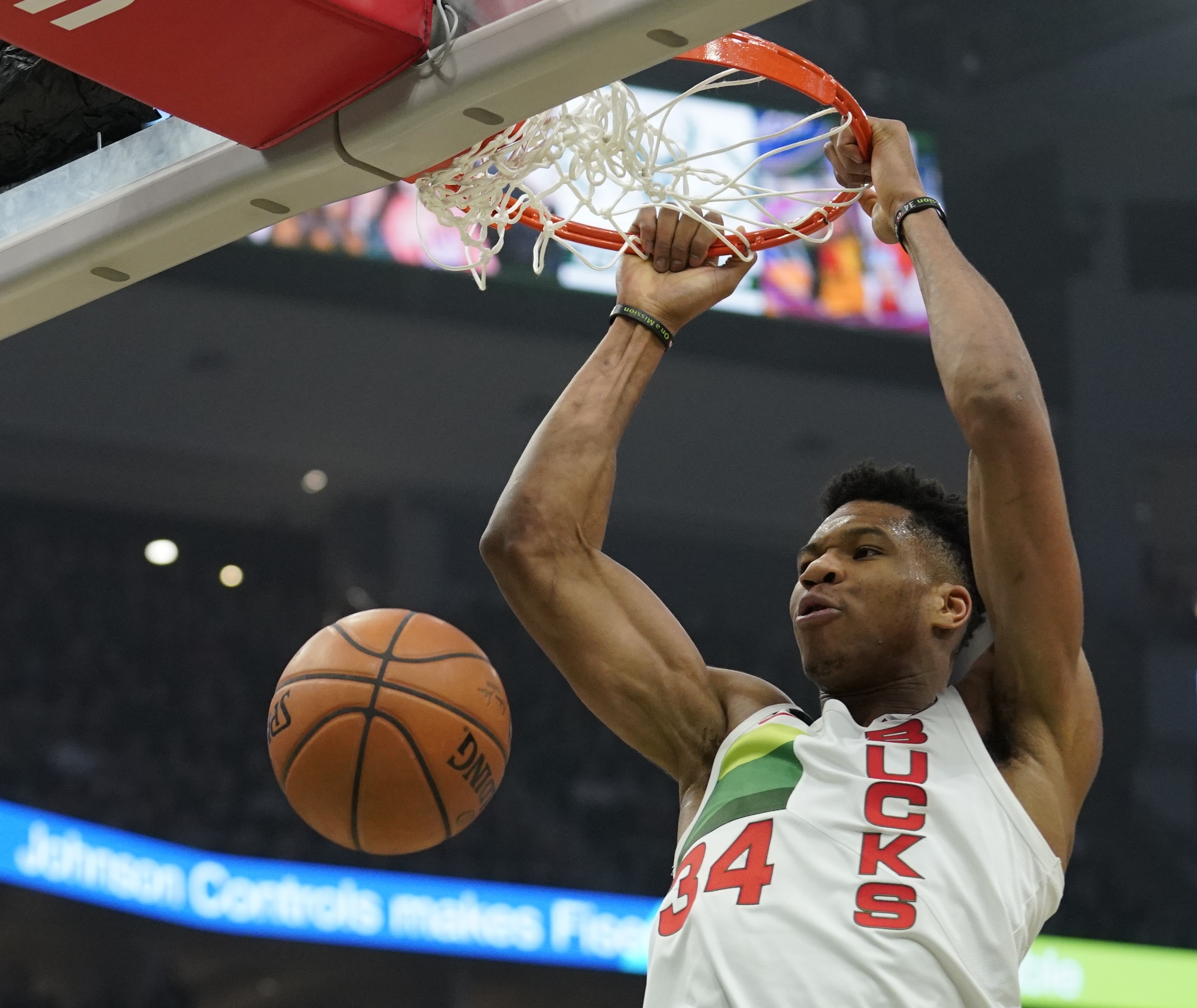 Giannis’ triple-double helps Bucks turn away Nets 129-115