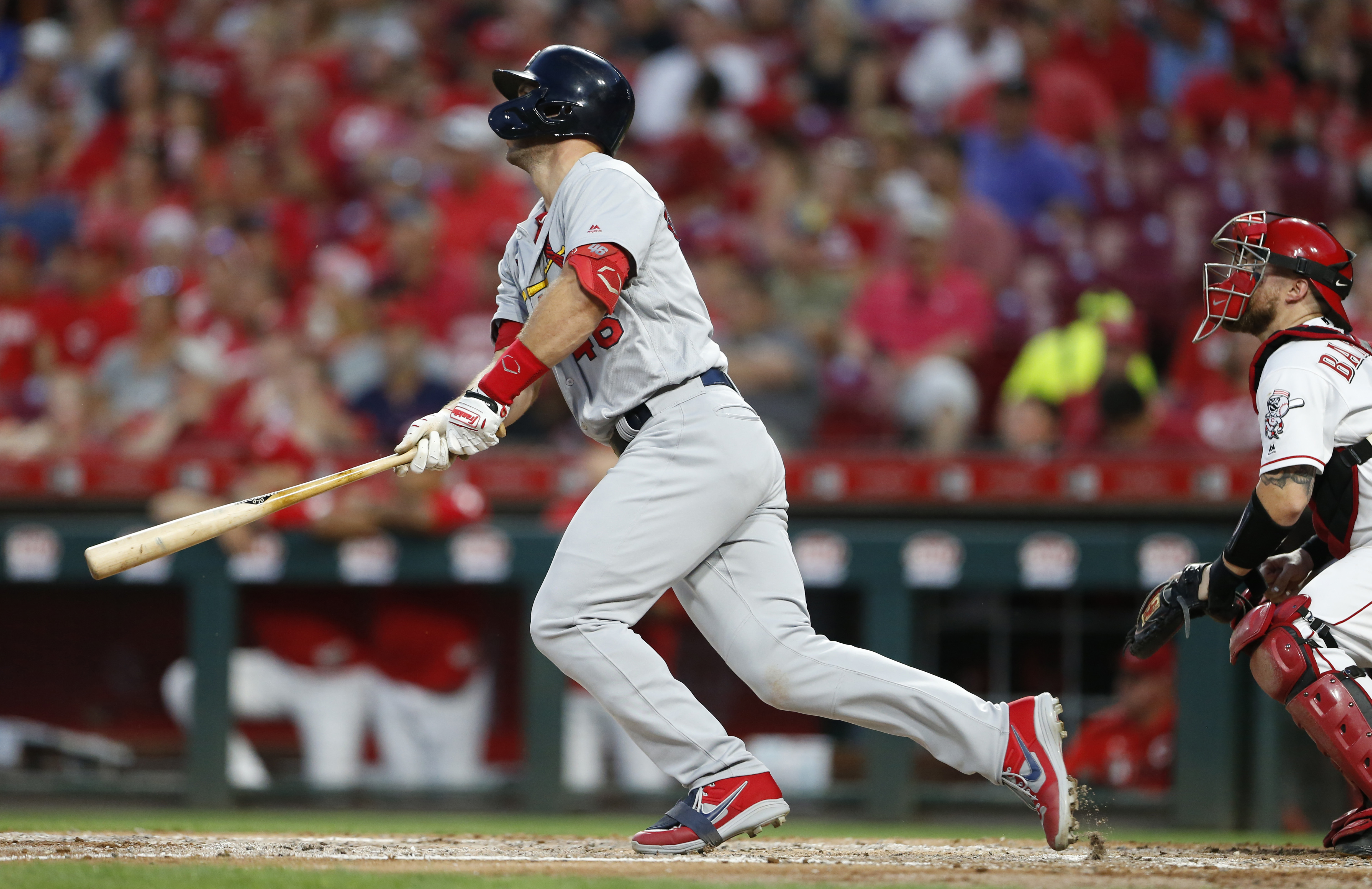 Cardinals take over first place with 13-4 romp over Reds