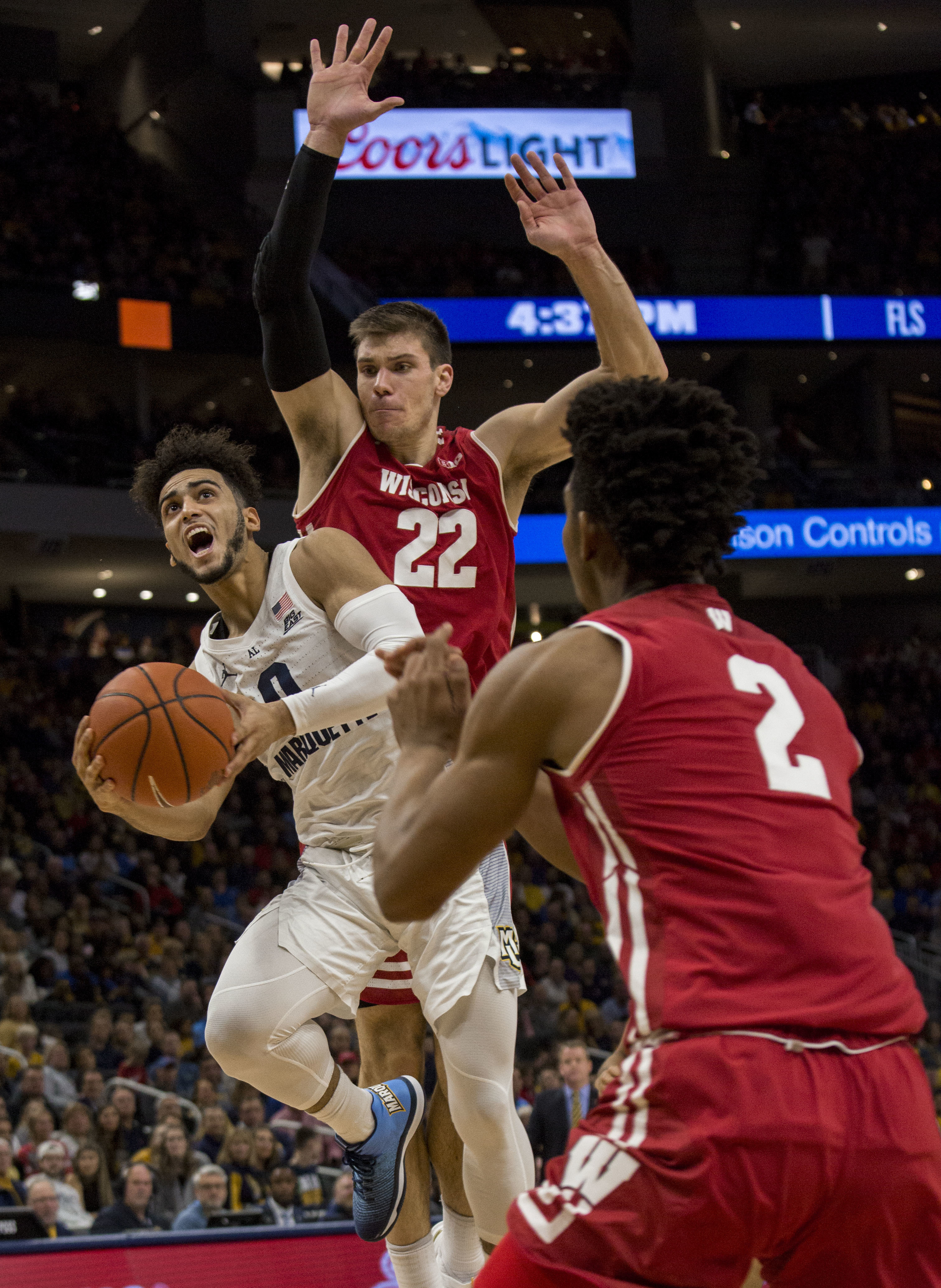 Marquette beats No. 12 Wisconsin 74-69 in OT; Howard has 27