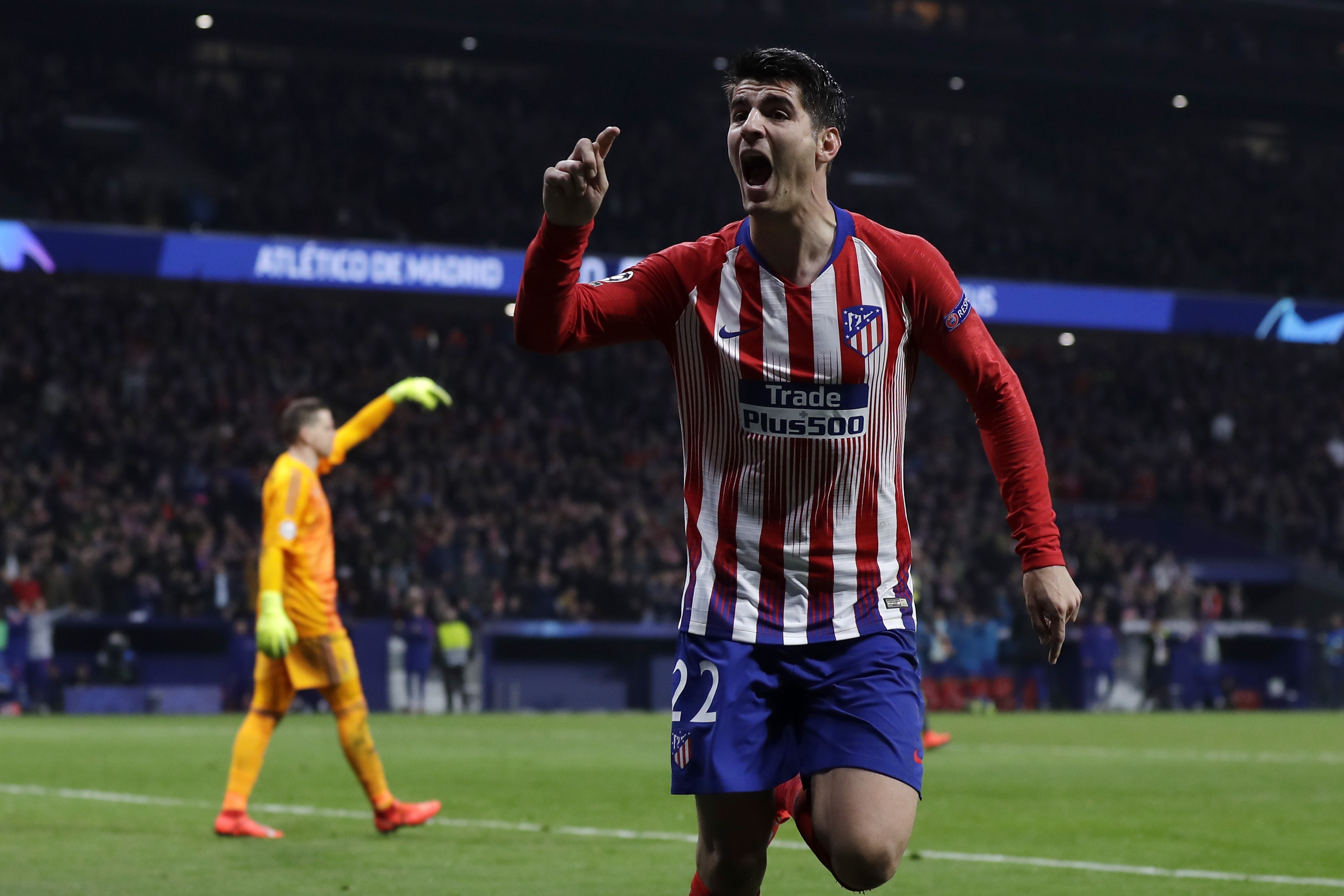 Morata scores 2 to keep Atletico in touch with Barcelona