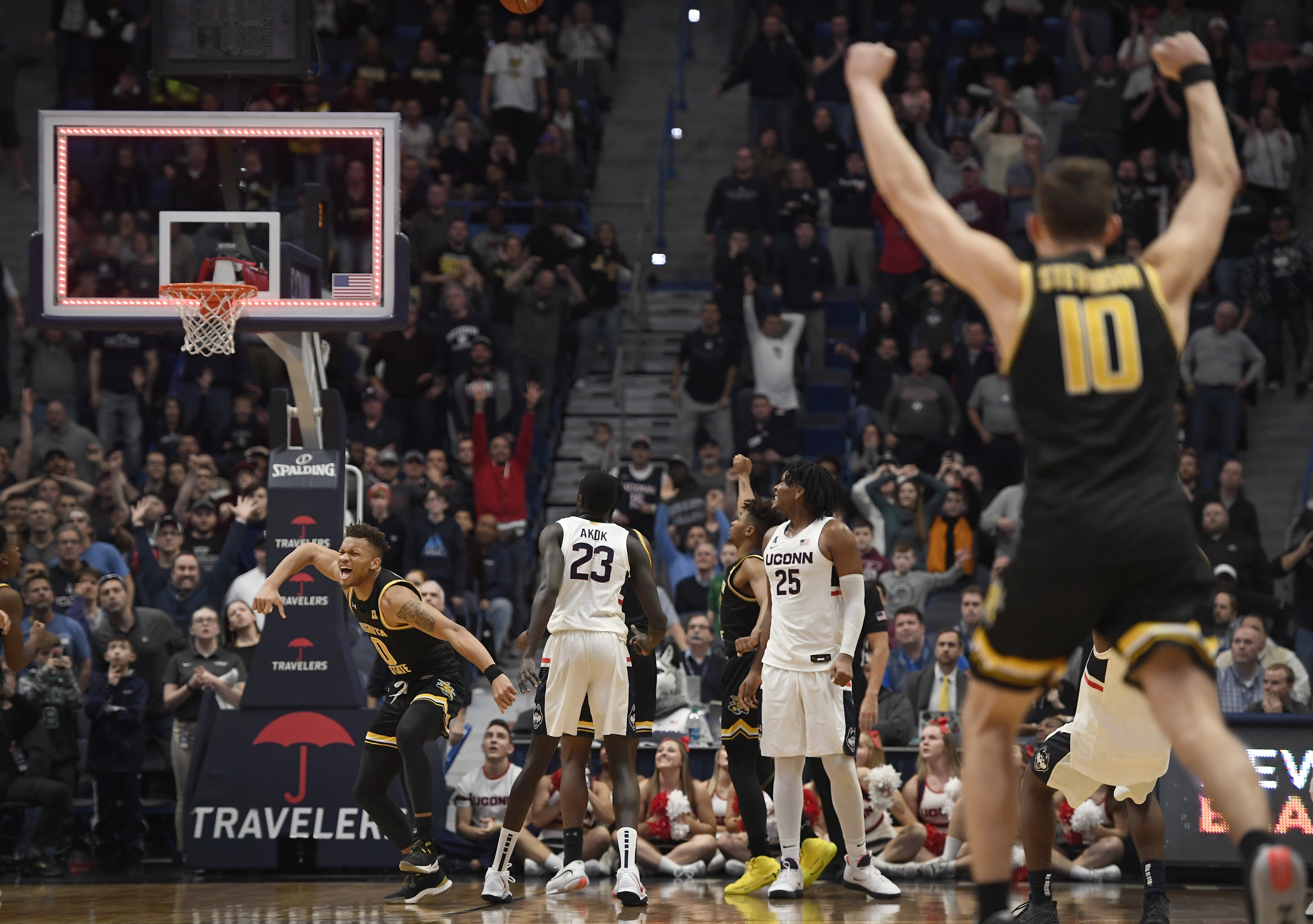 No. 23 Wichita State holds off UConn 89-86 in 2 OTs