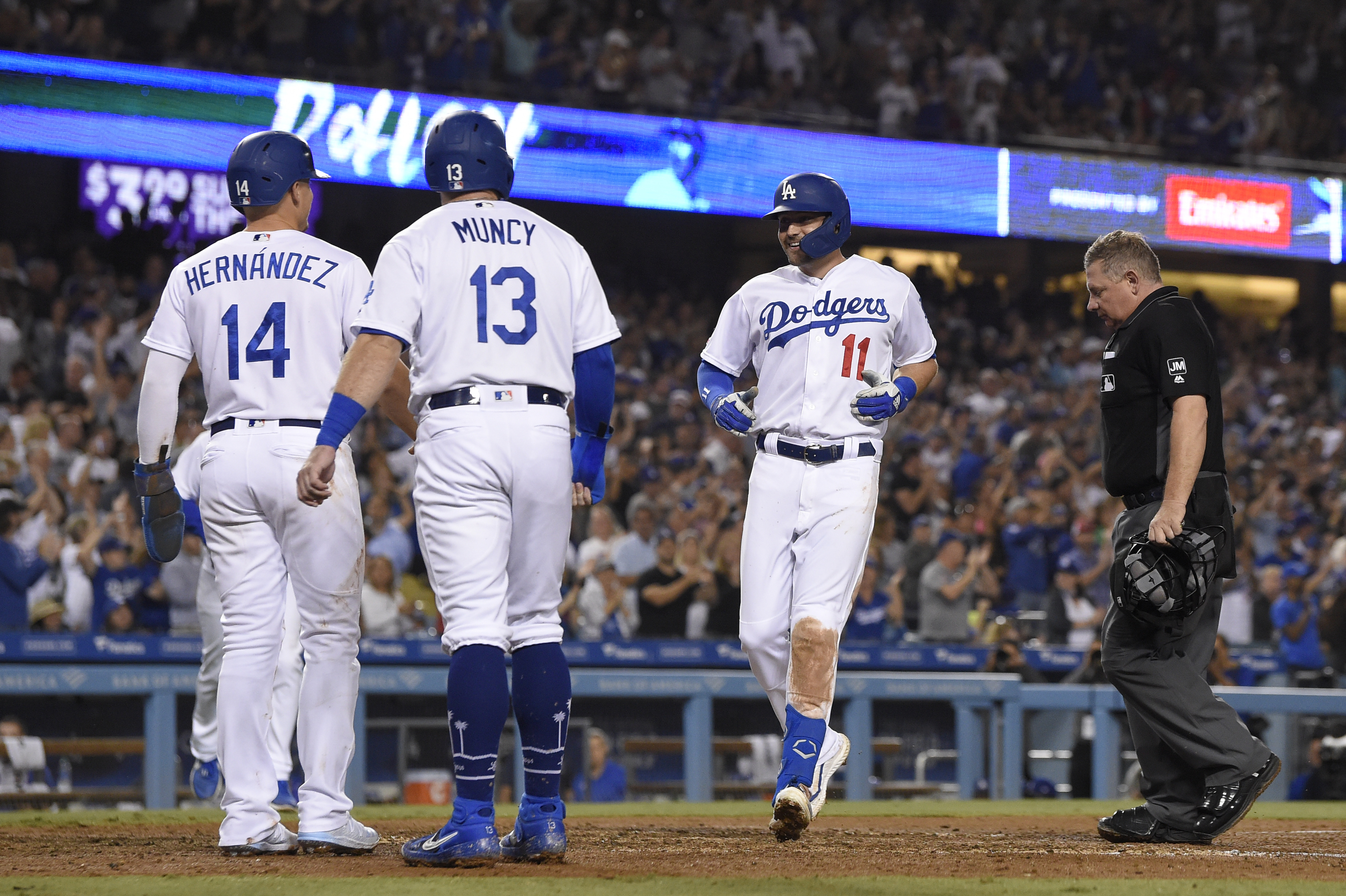 Pollock homers in Dodgers' 12-5 rout of Rockies for 99th win