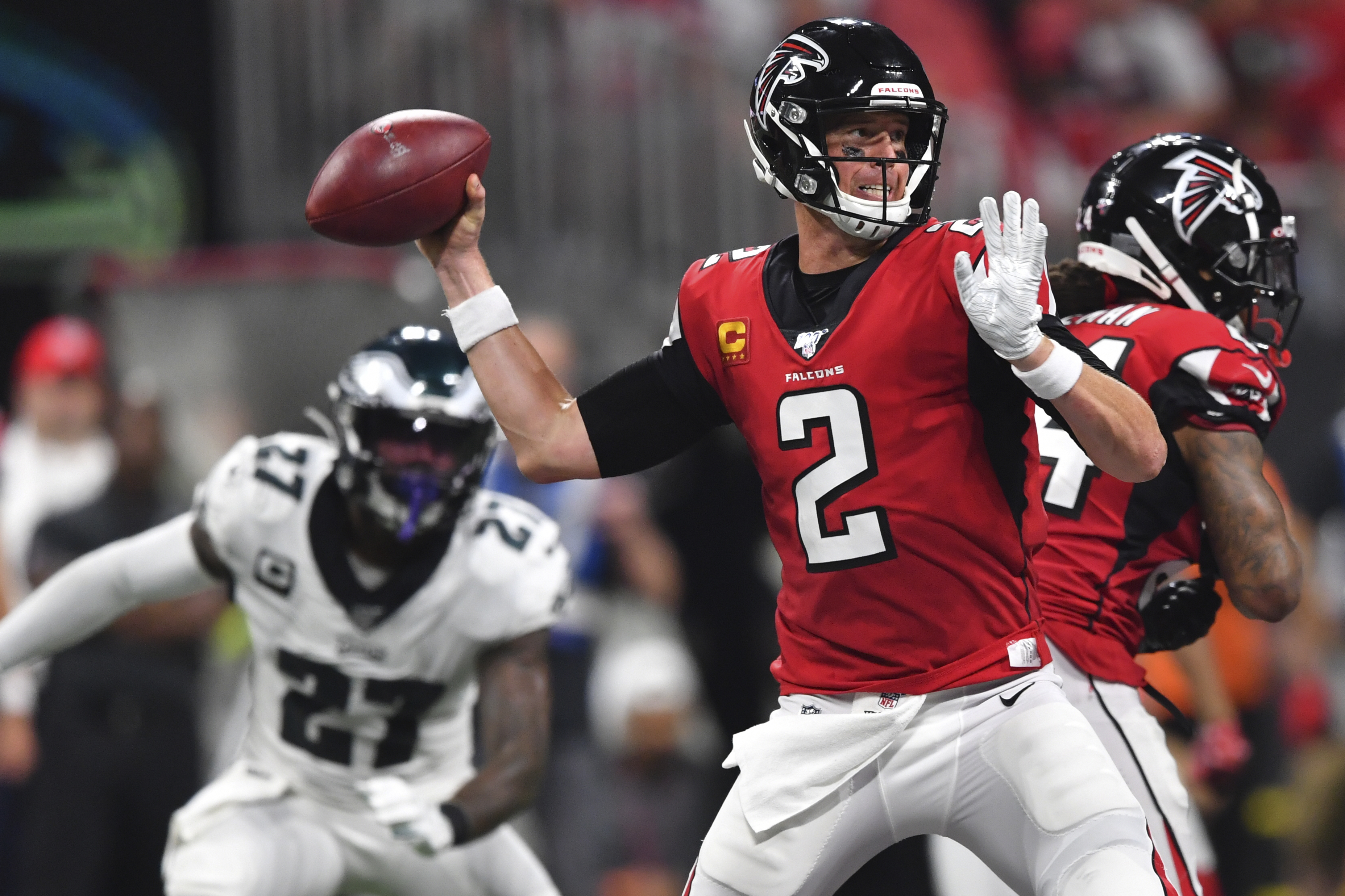 Ryan overcomes 3 interceptions to lead Falcons to first win
