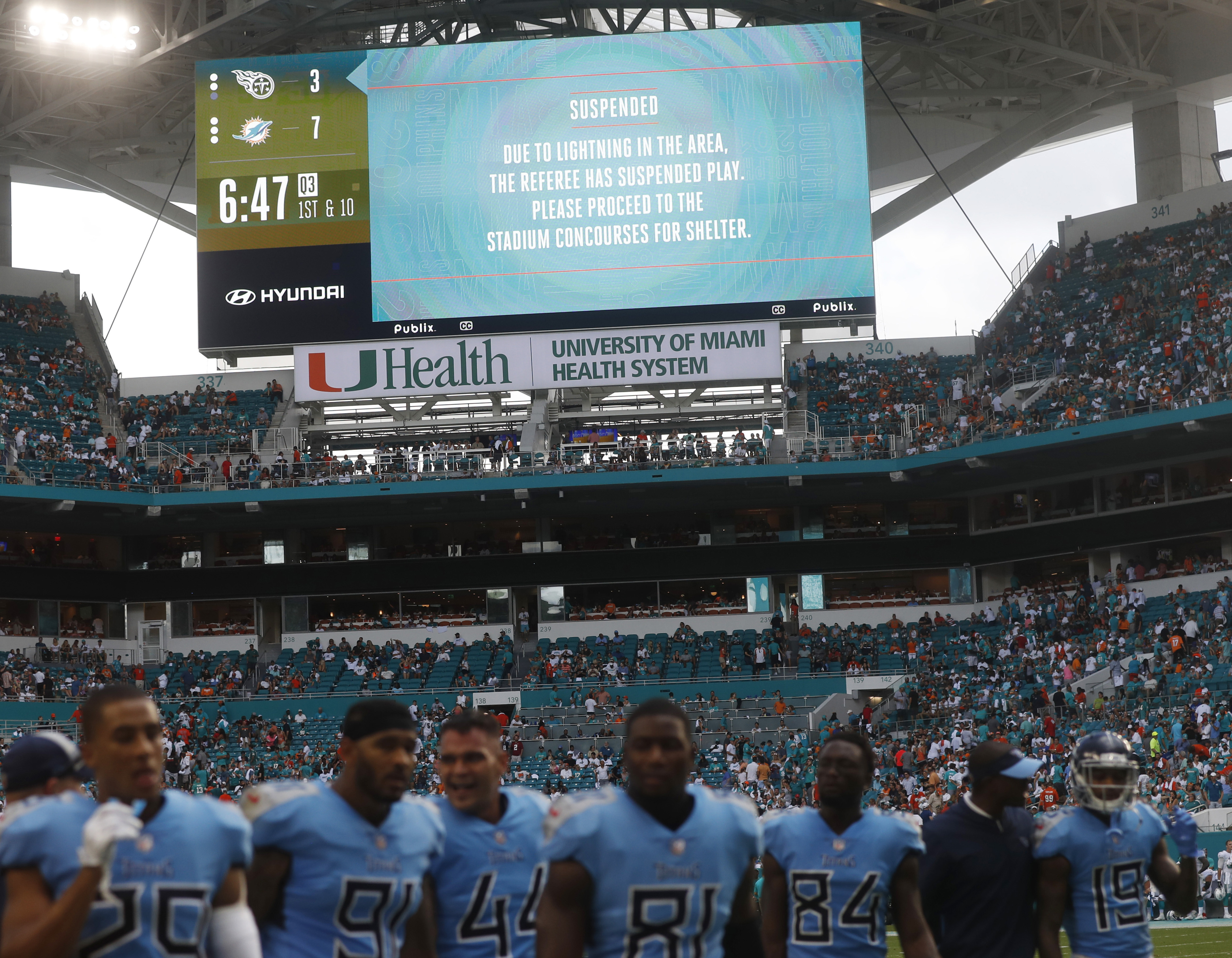 Enduring 2 weather delays, Dolphins win longest game _ again