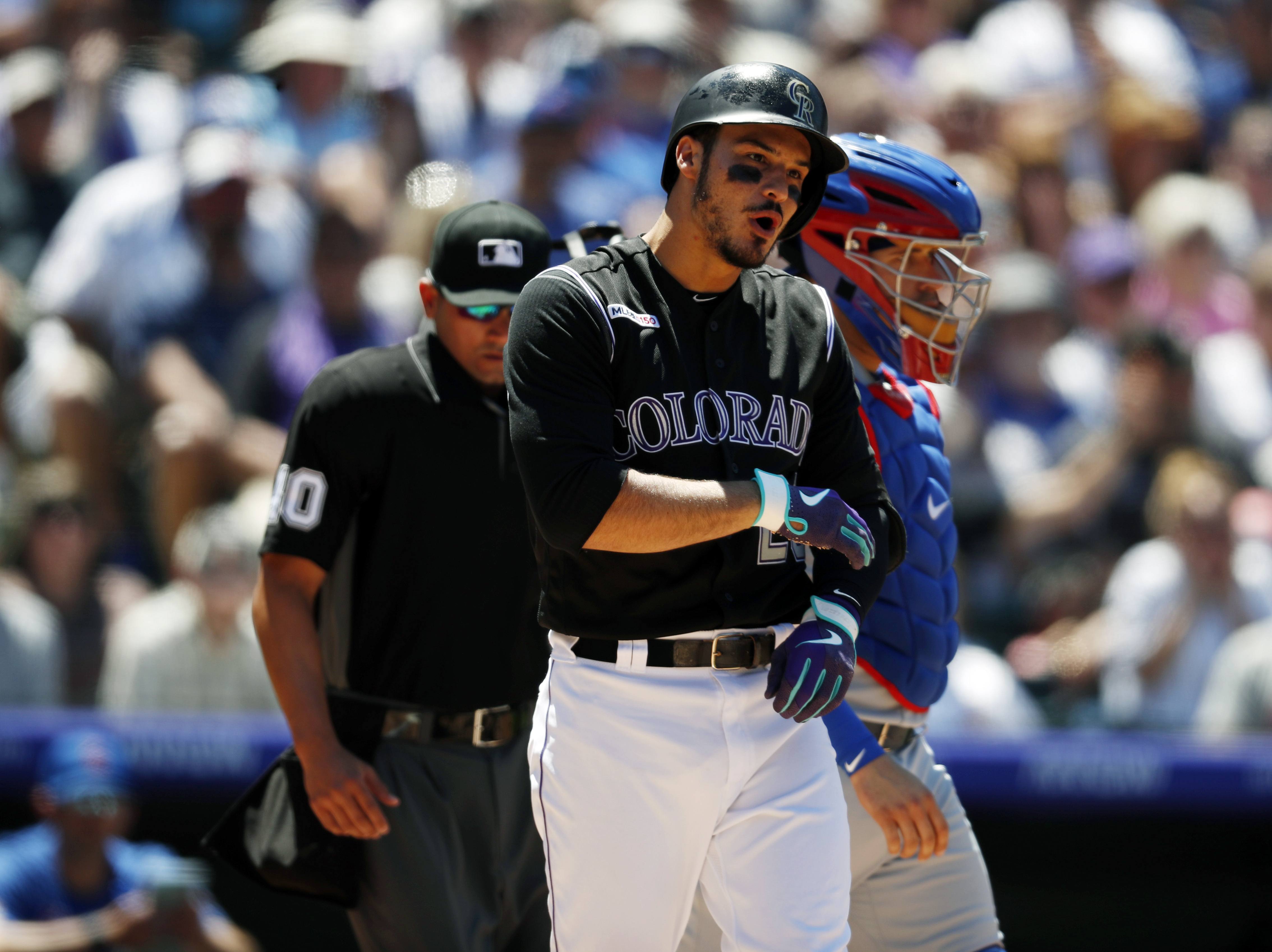 Rockies 3B Arenado hit by pitch on left forearm, leaves game