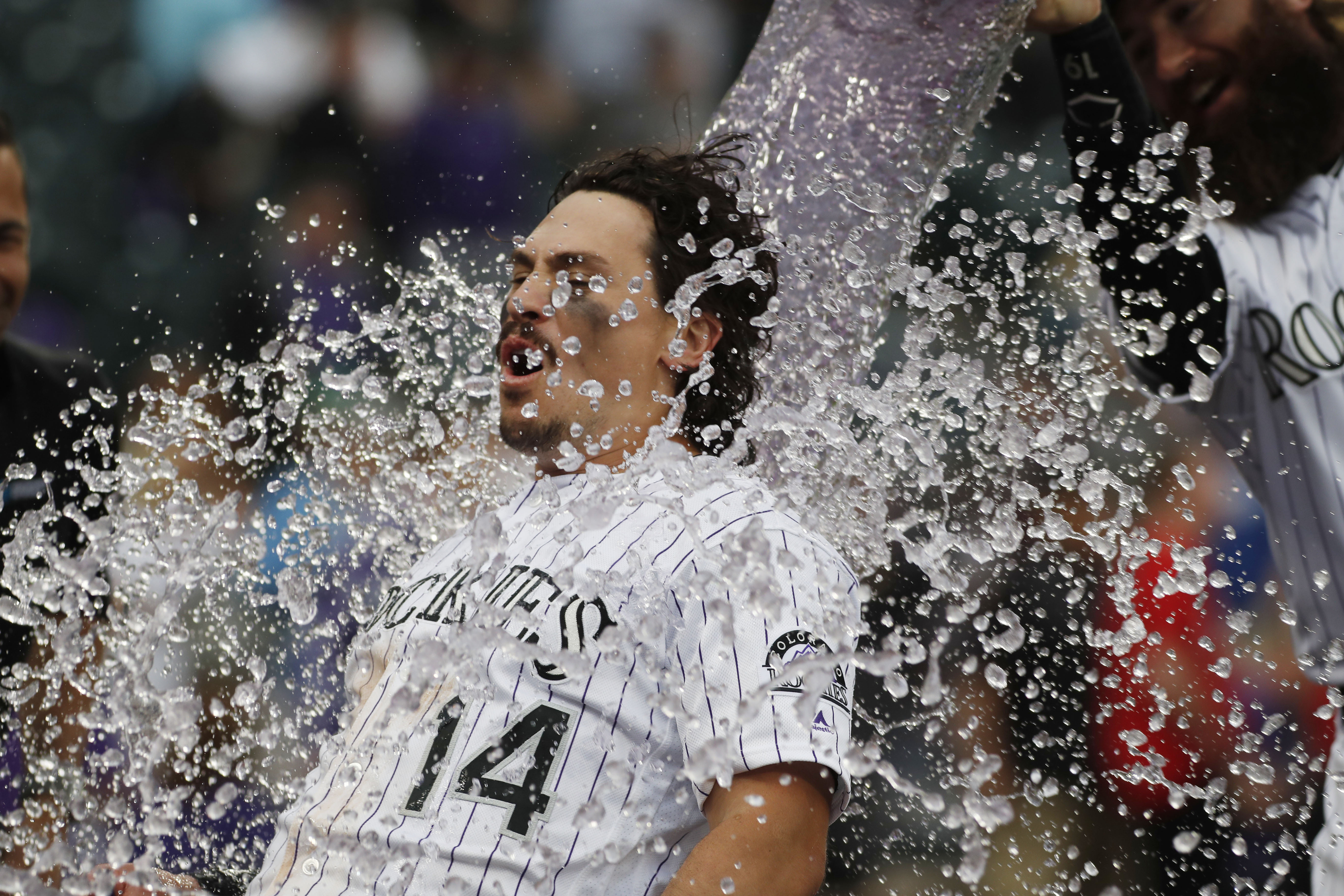 Arenado homers, Rockies score 2 in 9th to beat Orioles 8-7