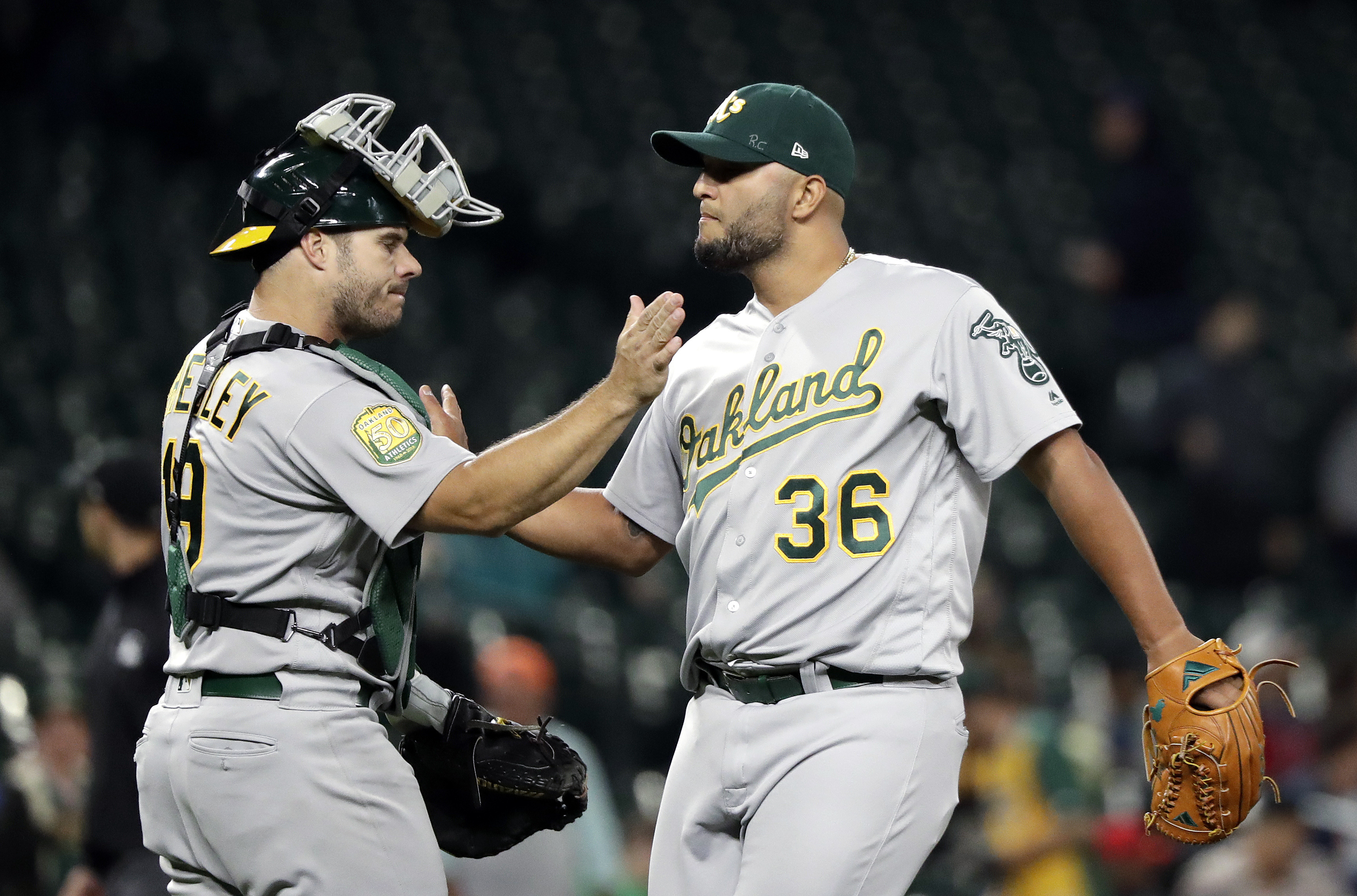 Olson’s slam helps A’s beat Mariners 9-3, close on Yankees