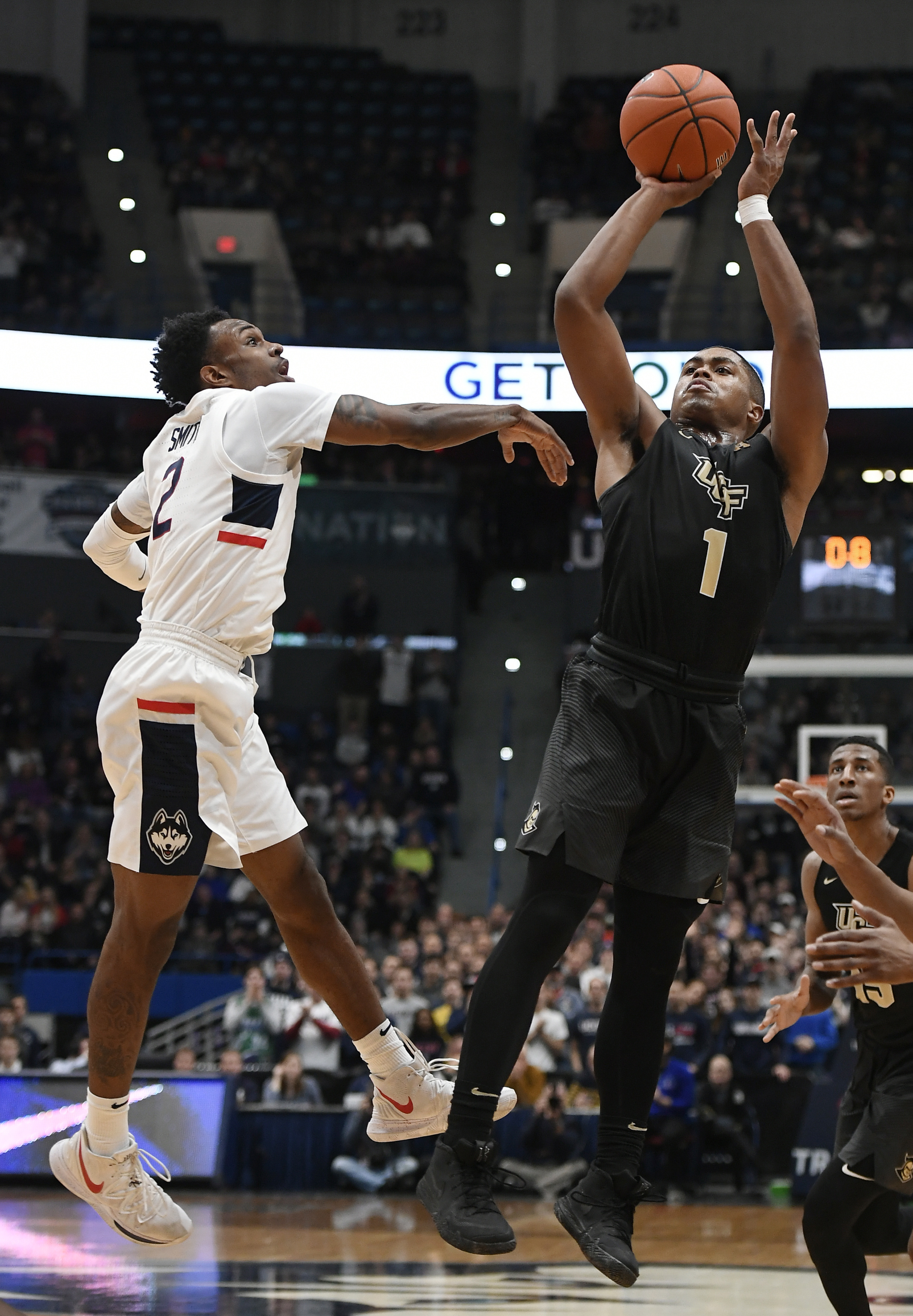Dawkins scores 13 points and UCF beats UConn on the road