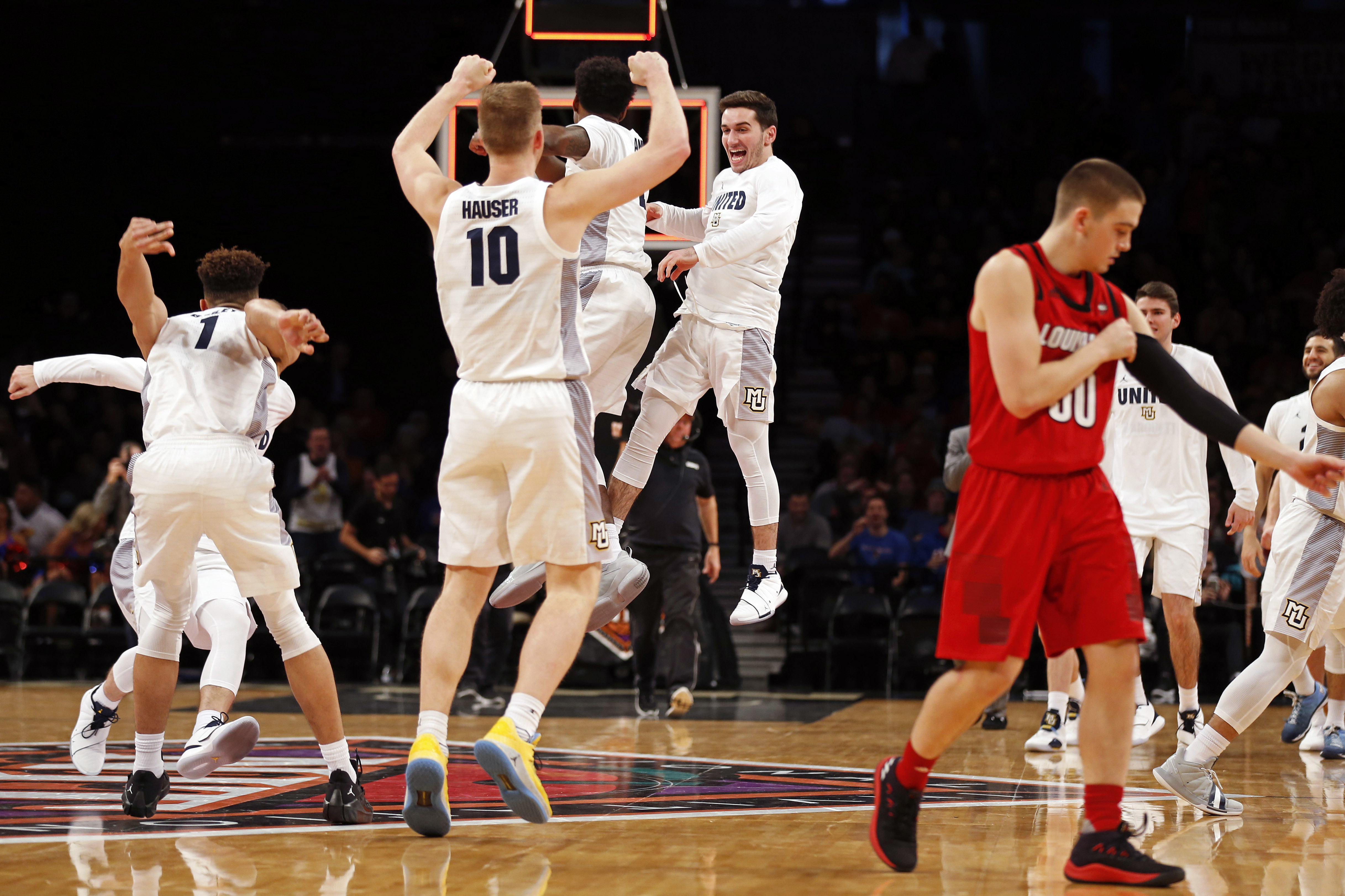 Howard leads Marquette past Louisville in NIT Season Tip-Off