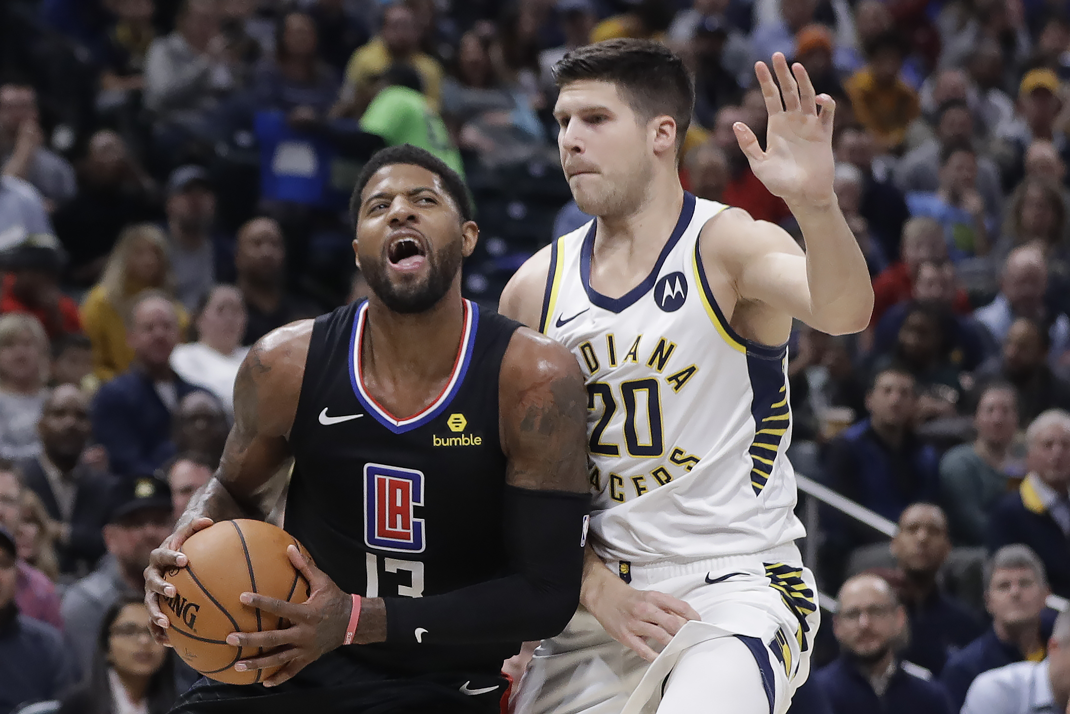 George silences boos as Clippers hold off Pacers 110-99