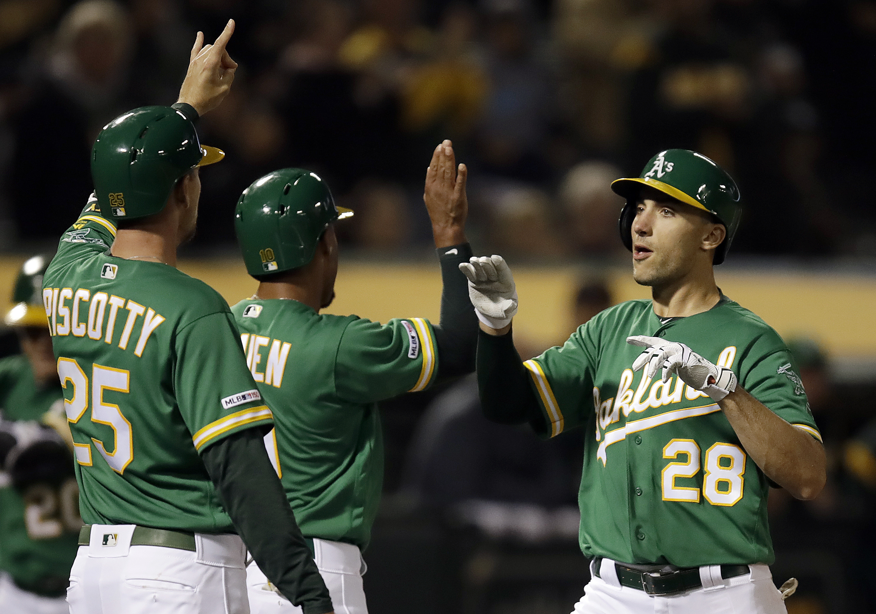 Olson, Canha go back-to-back in A’s 6-2 win over Mariners