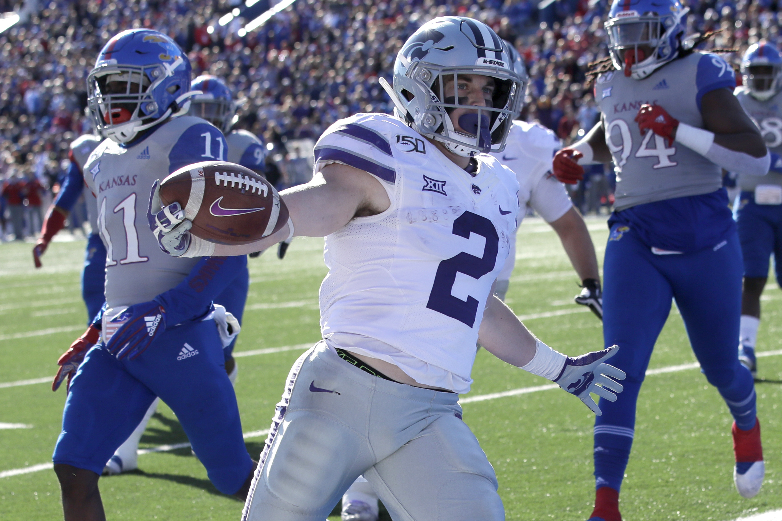 Thompson runs for 3 TDs as No. 22 K-State routs Kansas 38-10