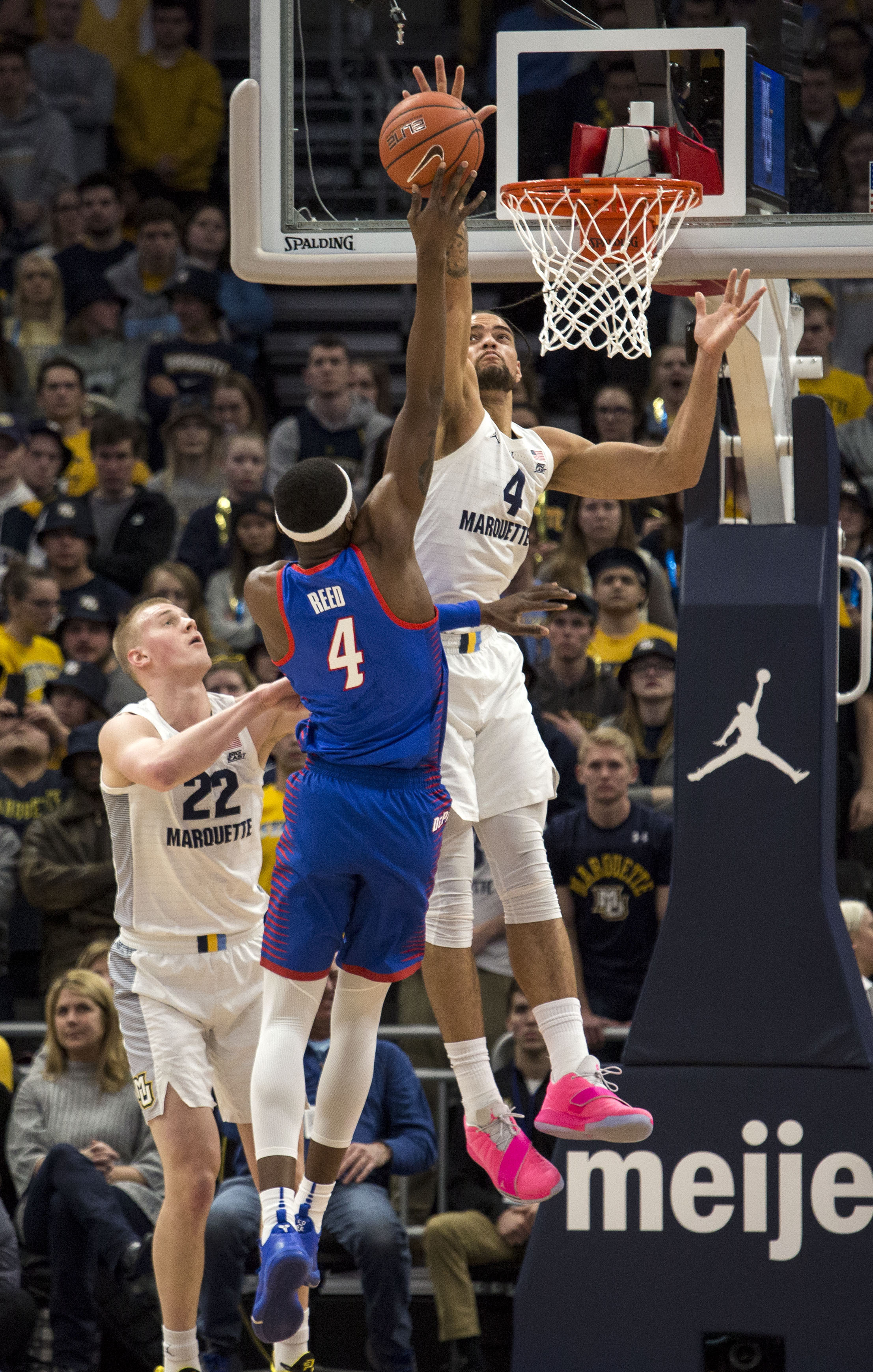 Howard scores 23 as No. 12 Marquette holds off DePaul 79-69