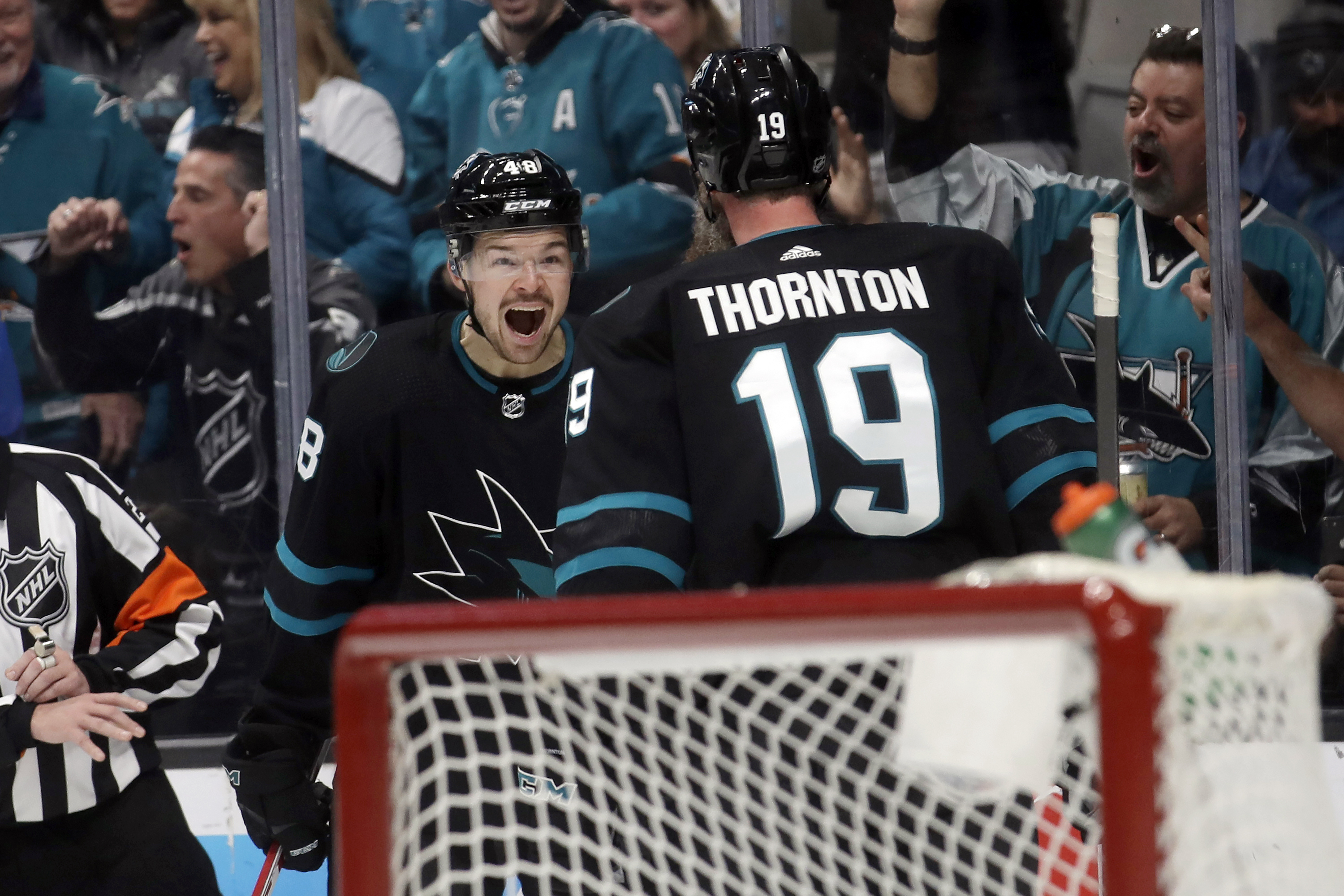 Sharks beat Canucks 4-2 to snap 6-game skid