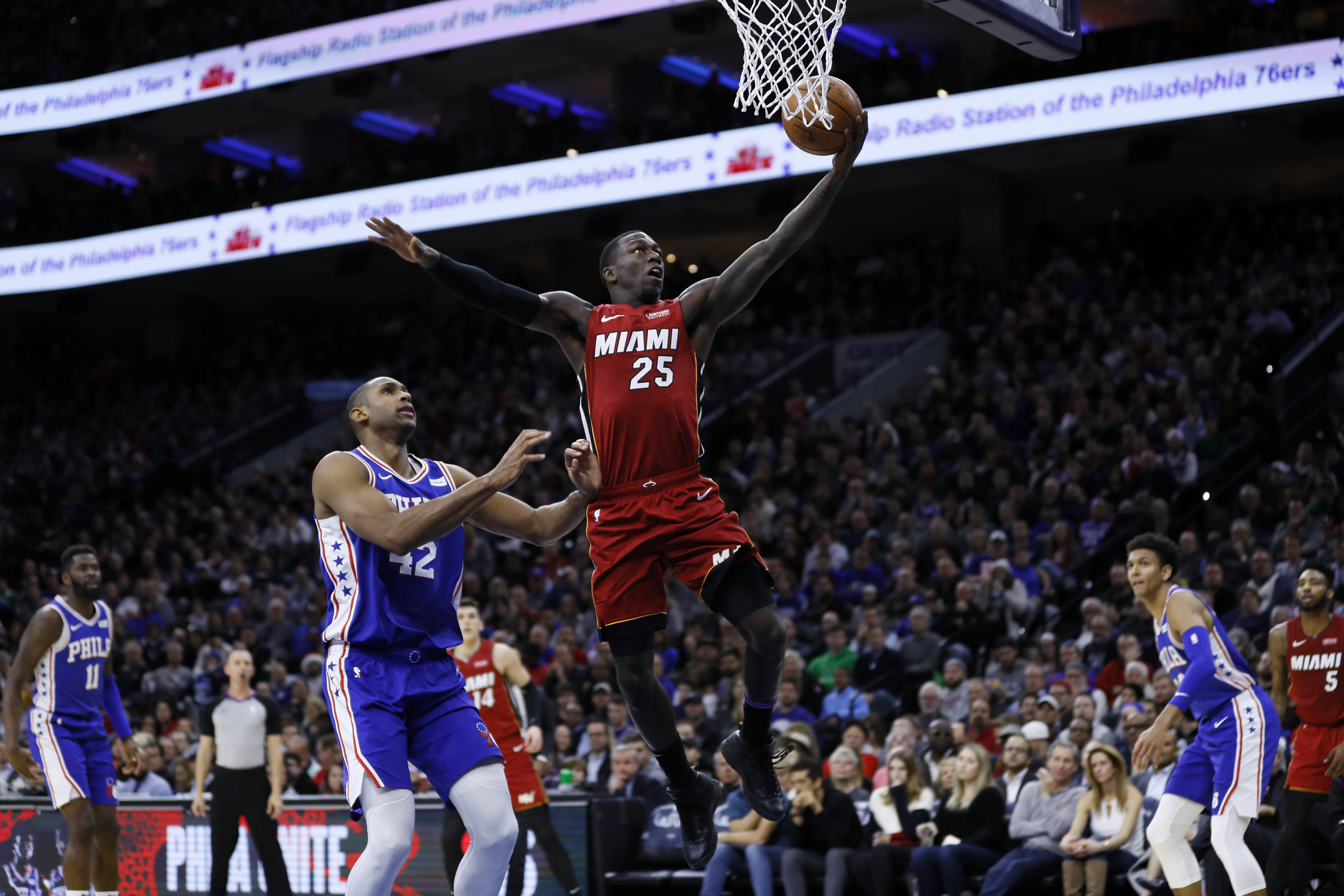 Heat hold on late, end 76ers' unbeaten start at home