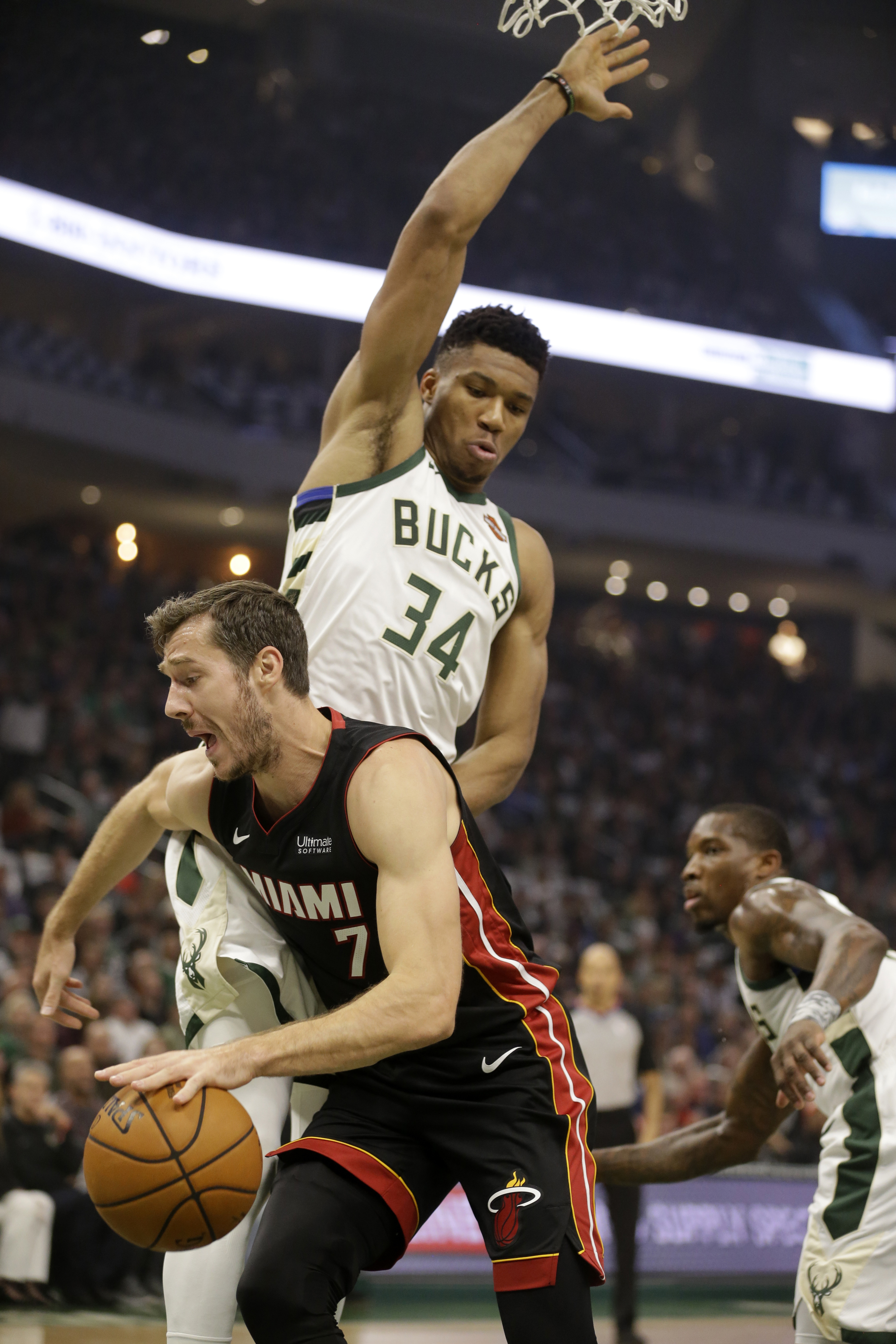 Heat spoil Bucks' home opener, rally to 131-126 win in OT