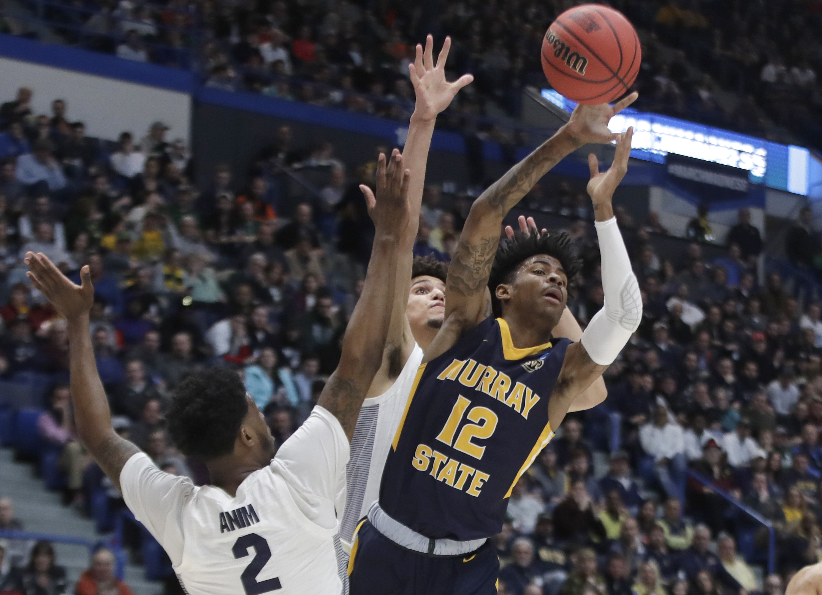 Morant’s triple-double leads Murray St past Marquette, 83-64