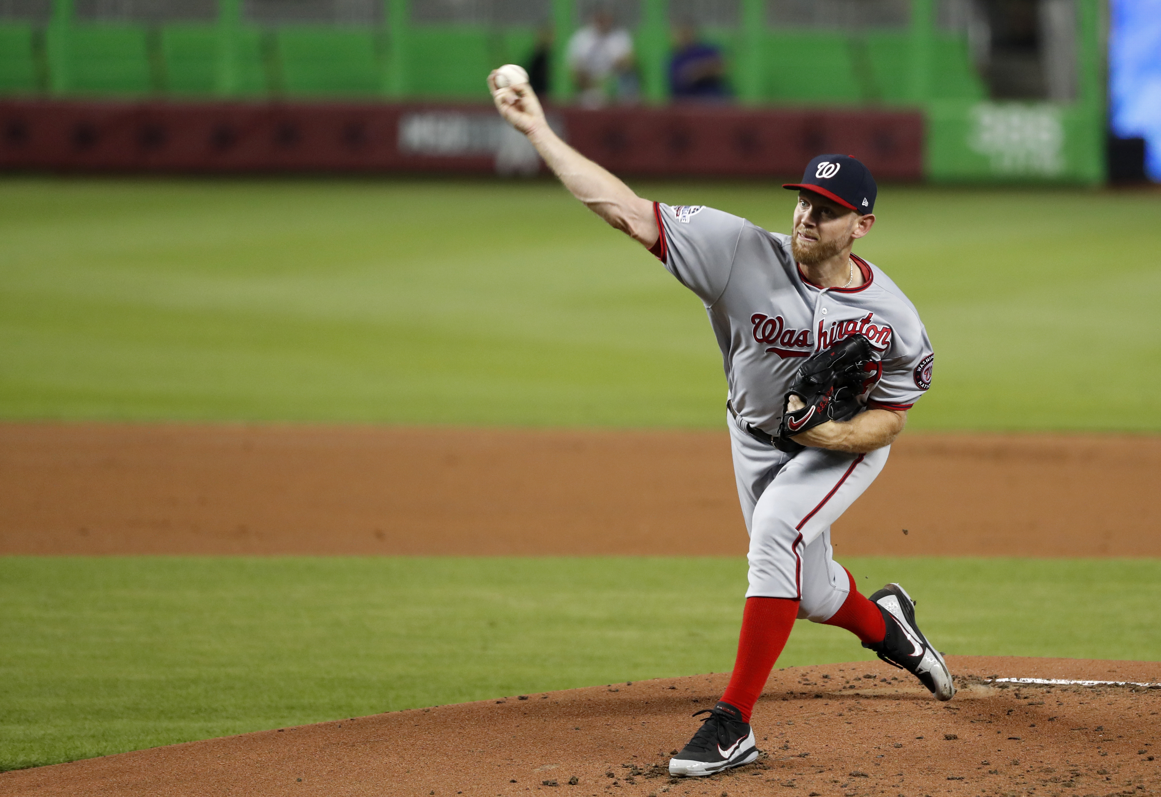 Strasburg fans 11, Nationals top Marlins 4-2