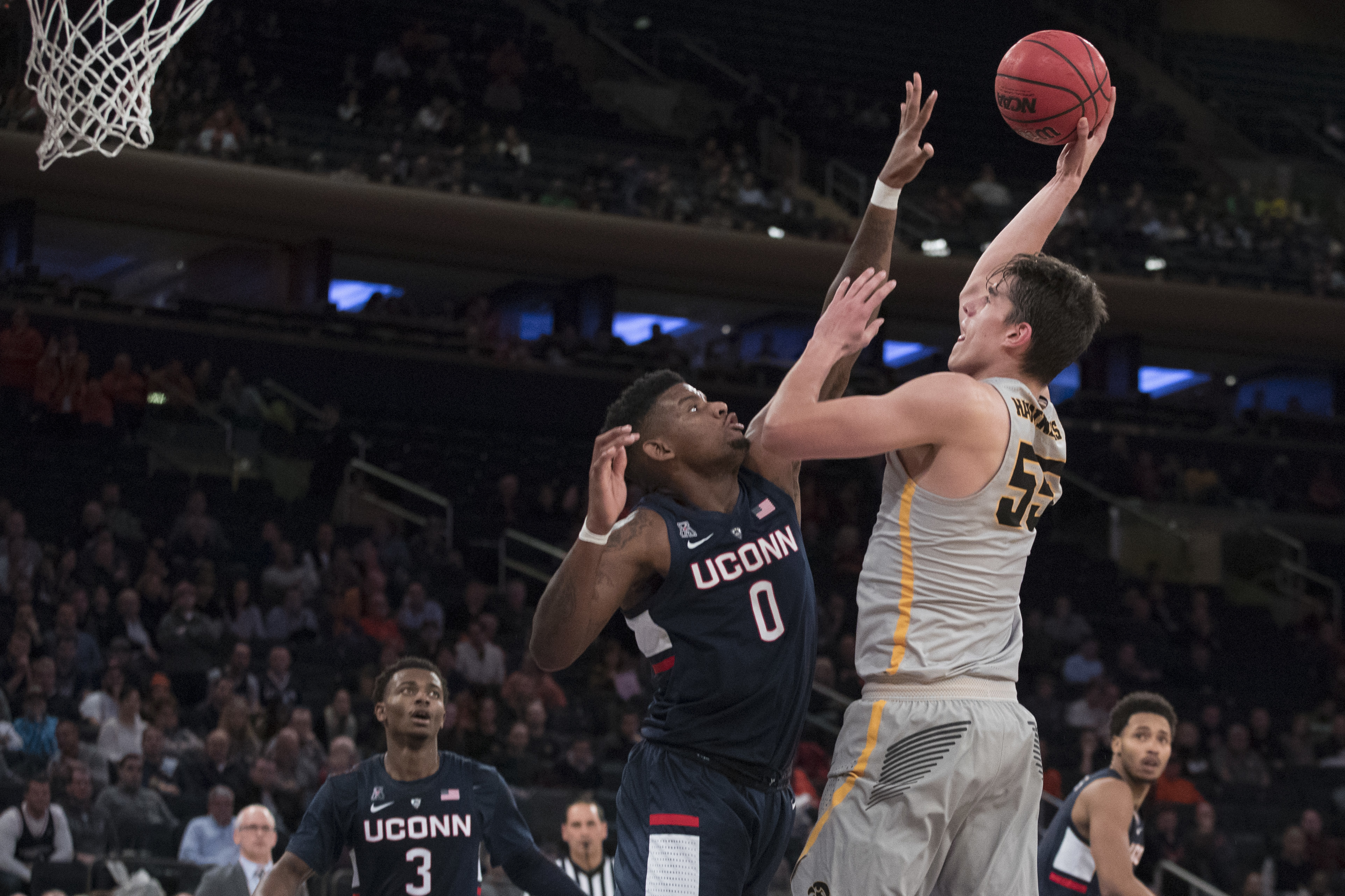 The Latest: Iowa beats UConn for 2K Classic title