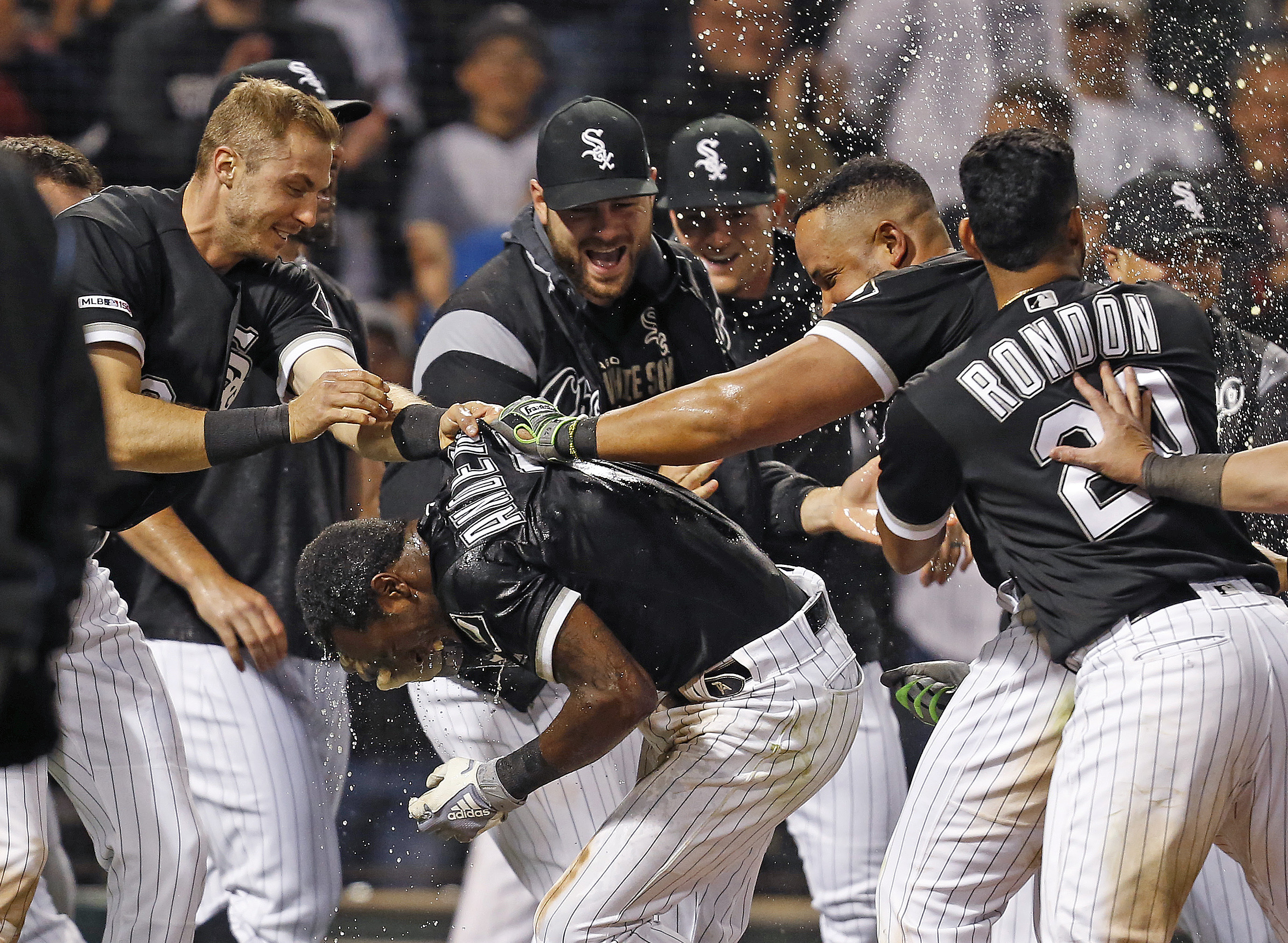 Anderson helps cost White Sox, then homer tops Tigers 12-11