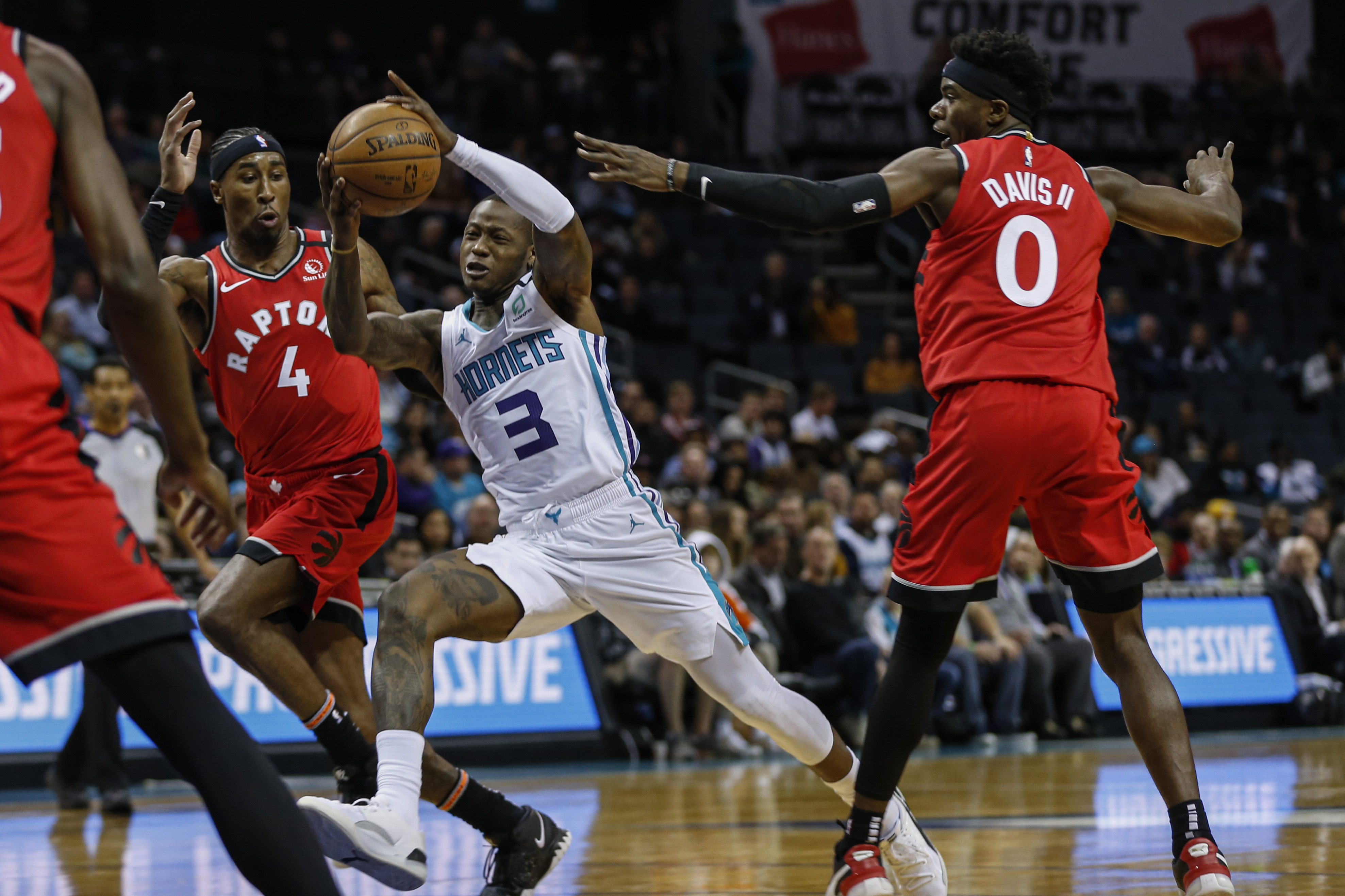 Davis, Ibaka lead Raptors past Hornets in OT, 112-110