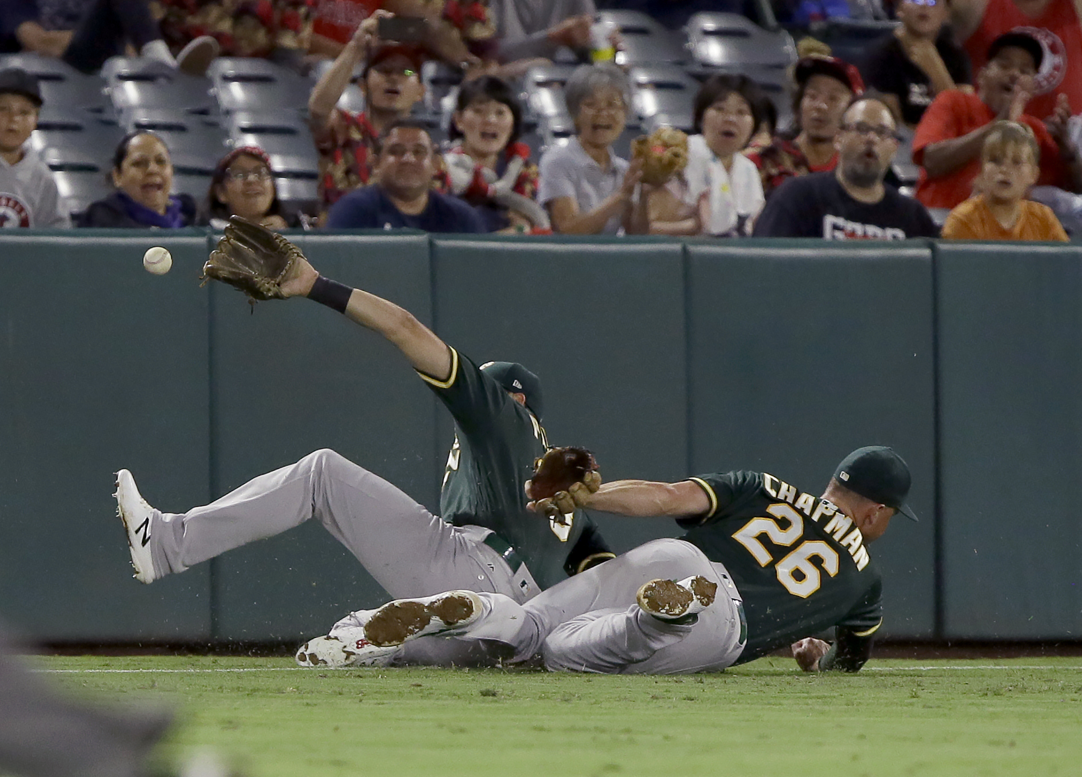 A's lose to Angels, lead over Rays down to half-game
