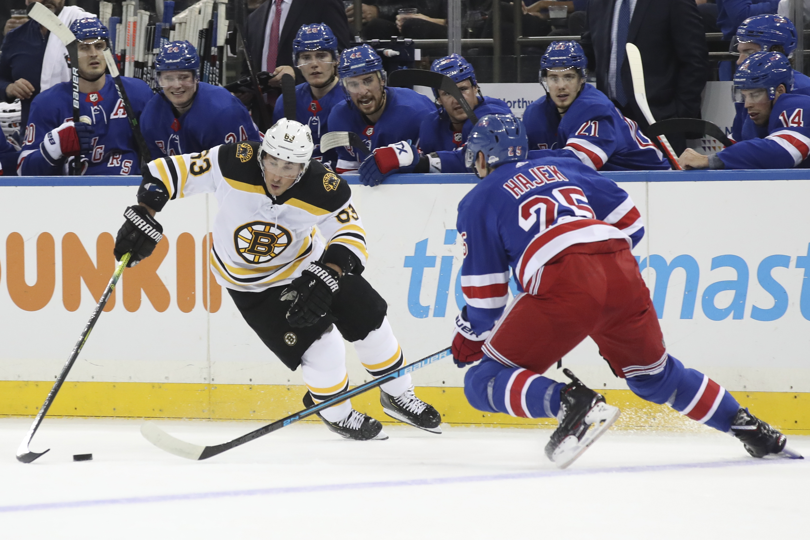 Marchand, Bergeron lead Bruins to 7-4 win over Rangers
