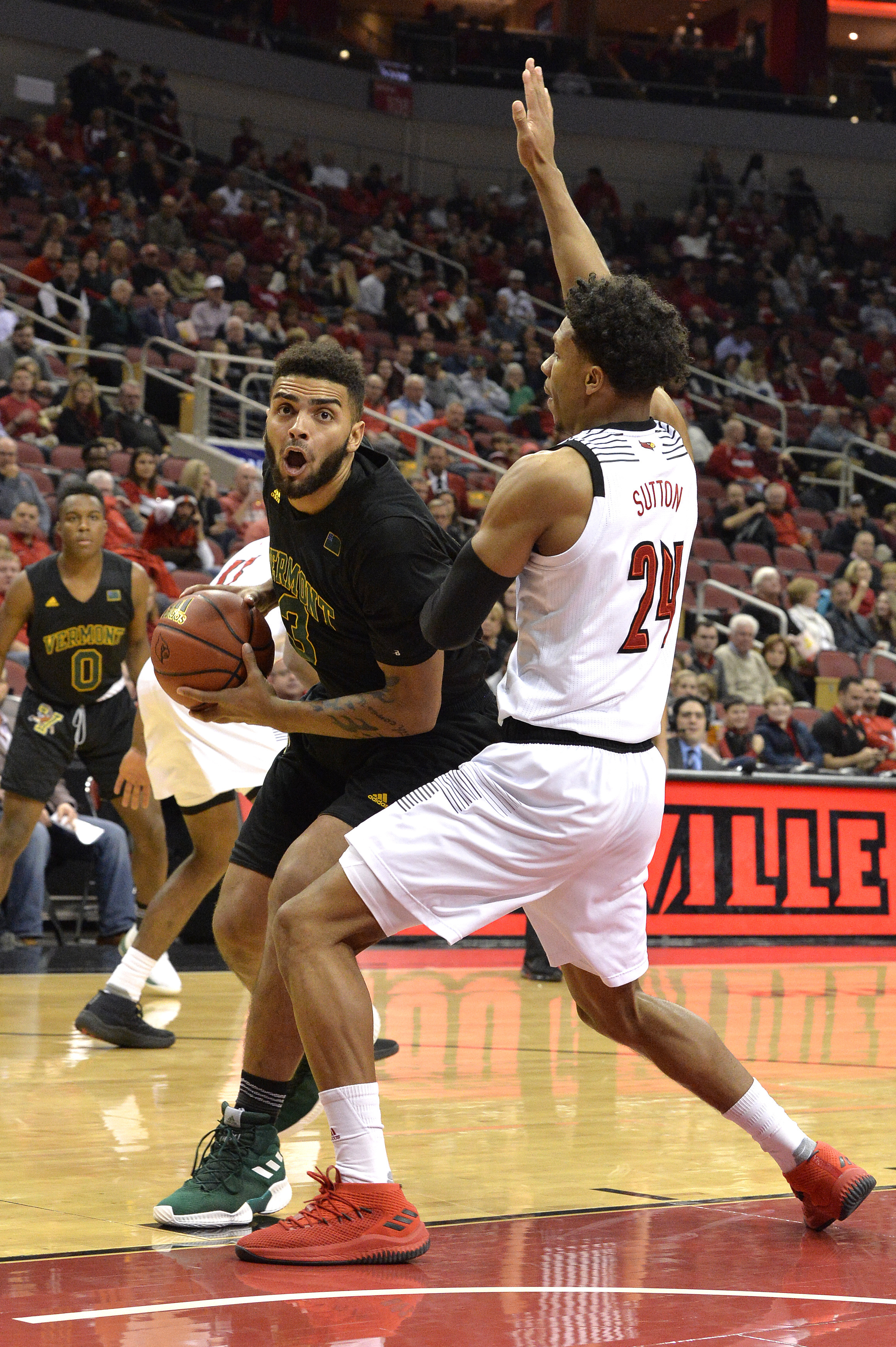 Louisville holds off Vermont 86-78 to improve to 3-0