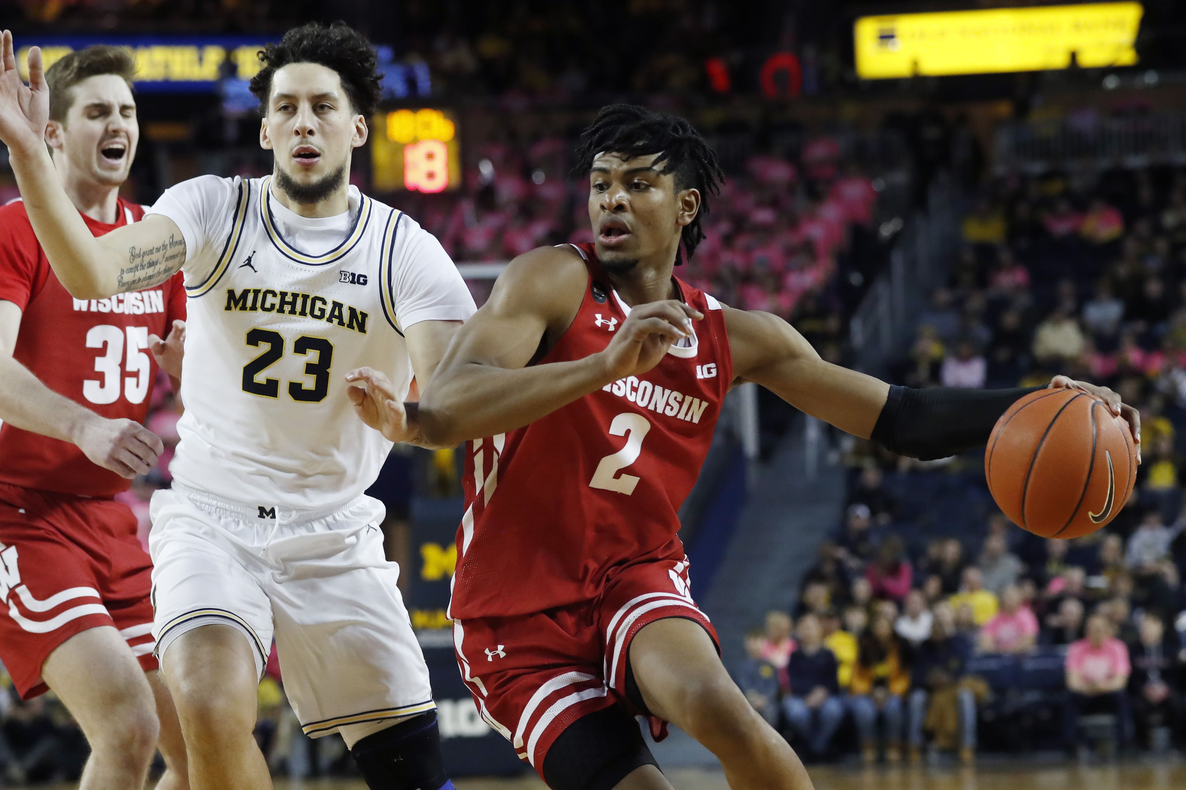 Trice, Wisconsin hold off No. 19 Michigan 81-74
