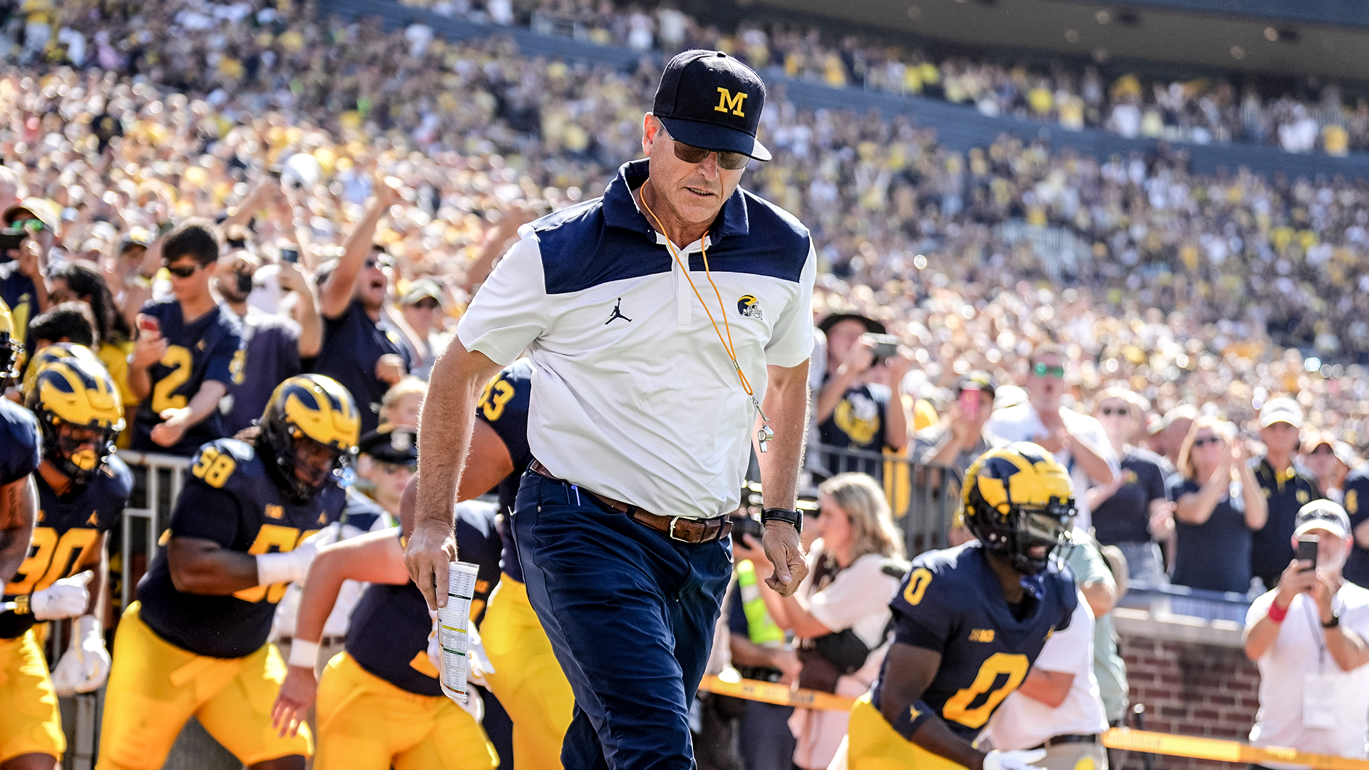 Jim Harbaugh 'chasing' CFP title but has 'unfinished business' in NFL